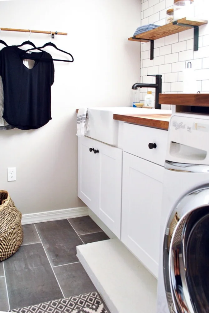 Farmhouse laundry room with subway tile, and gray ceramic tile floors | Sharp + Grey Interiors