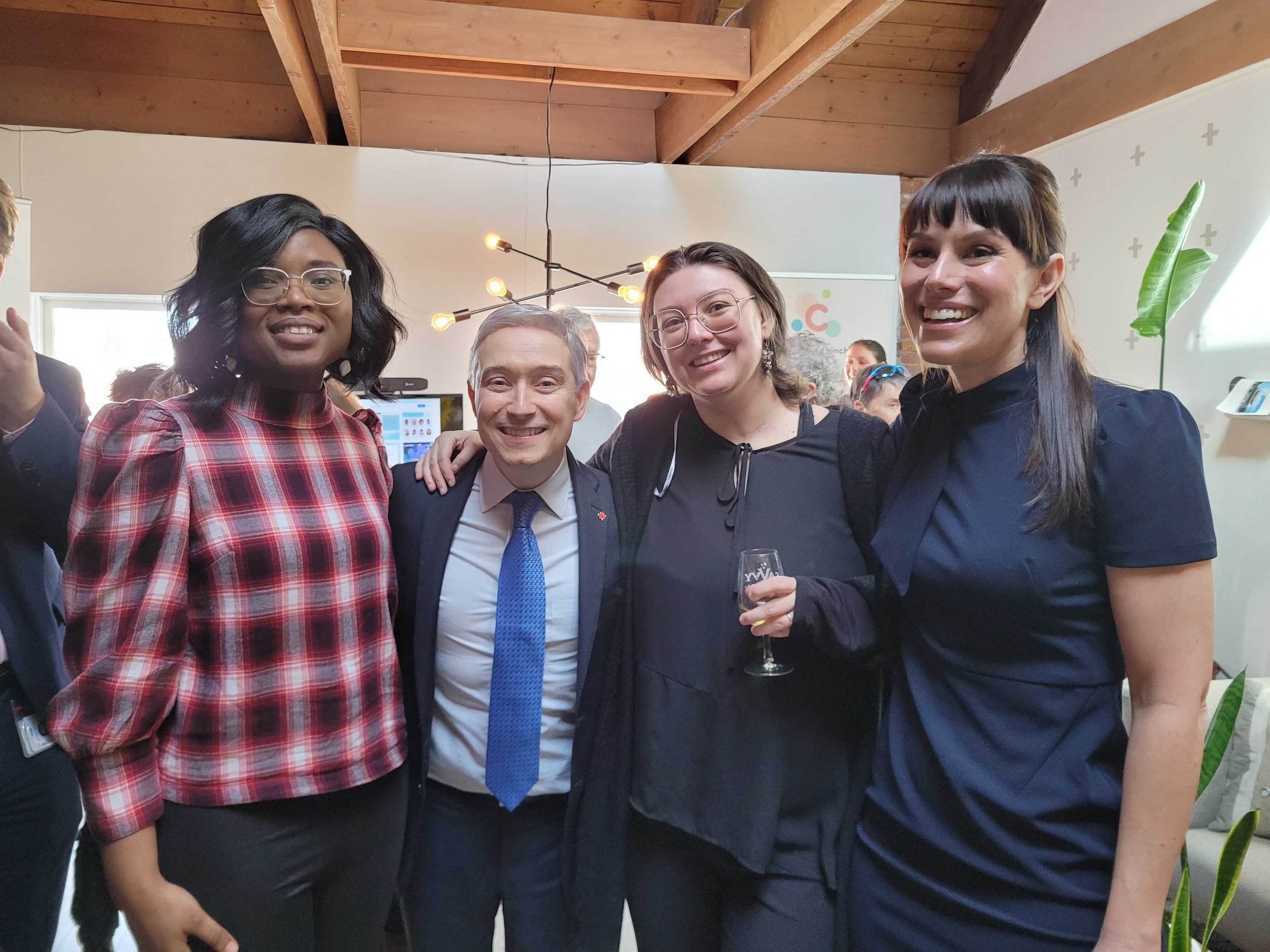 Minister Champagne with volunteers.jpg