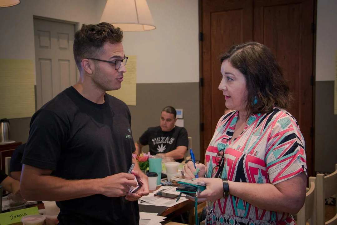 Iris Gonzalez interviews a person for quotes to add to a developing story. Courtesy Marcus Macias Photos..jpg