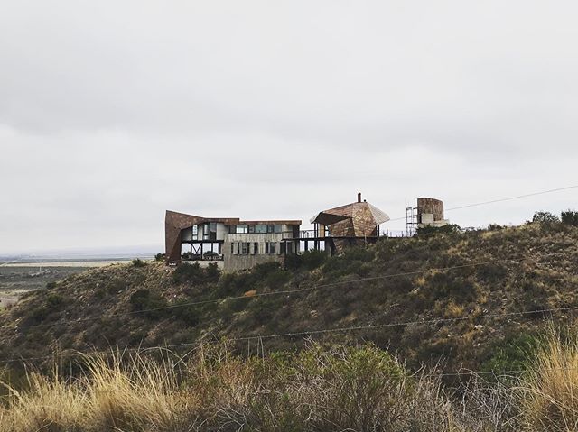 The industrial materials and construction methods of the modern architecture in the mountains of Lujan de Cuy&oacute; near Mendoza, Argentina reflect the sparse surroundings. The naked eye can see as far as 100 miles out here. Smokestacks and power p