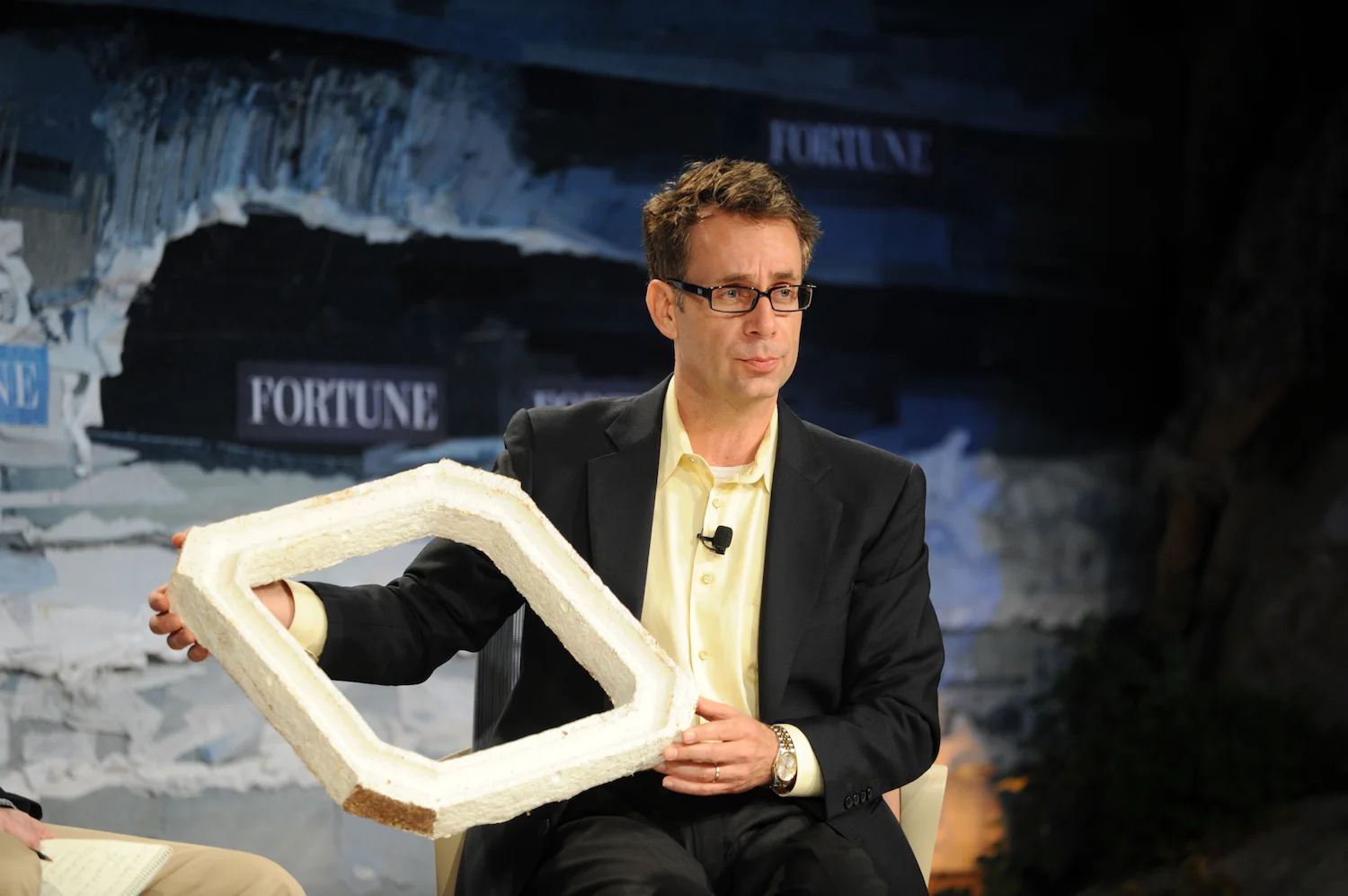 Oliver Campbell holding up mushroom based packaging for Dell servers