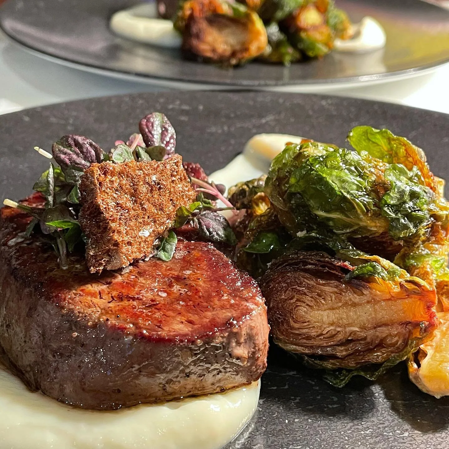 Masami Wagyu filet mignon with freeze dried balsamic, cauliflower onion pur&eacute;e, and fried brussel sprouts