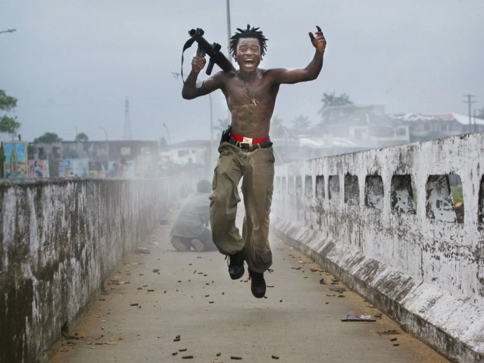 Chris Hondros/Getty Images; Courtesy of HONDROS Film