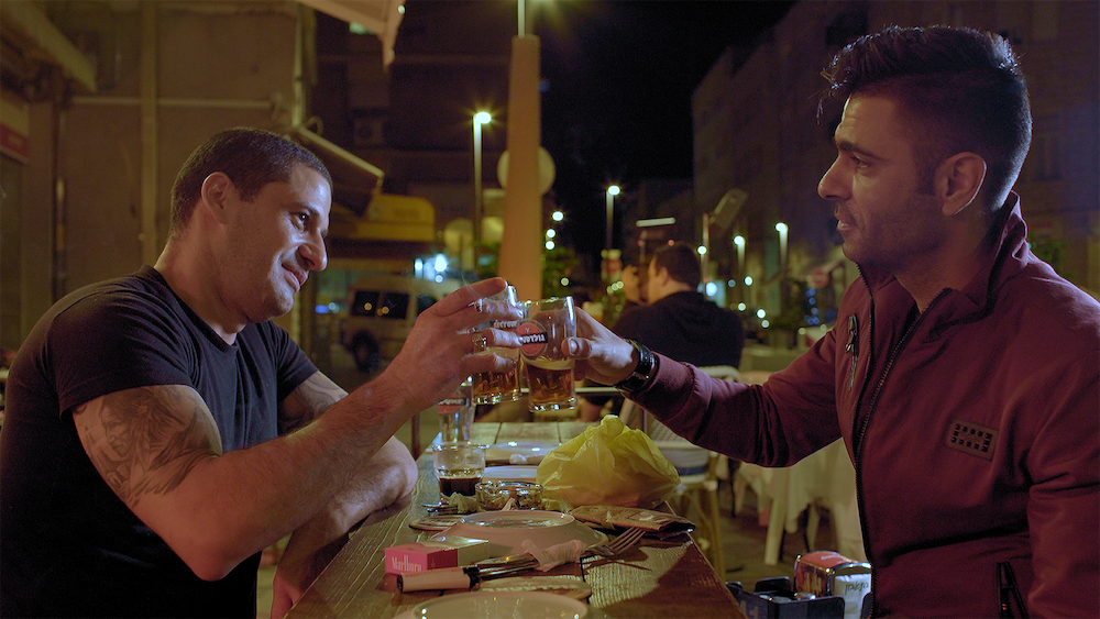 Shlomi, a Jewish chef from Haifa and Ali, an Arab chef from a village in the Golan, share a meal