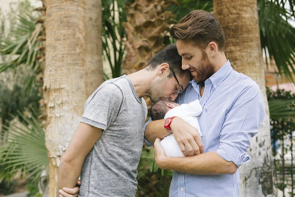 Nicolas and Aurelien hold little Louise in a still from ‘Ghosts of the République’ by Jonathon Narducci