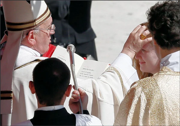 Pope Francis anointing in Sacrament of Confirmation