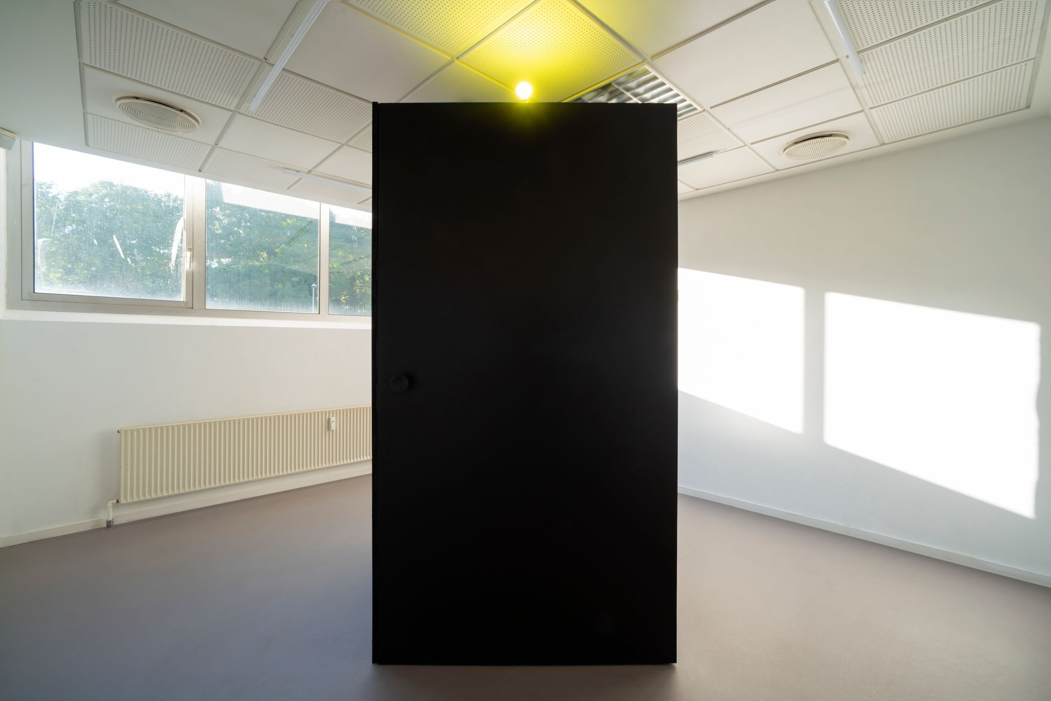 The green light is on and you can now enter the installation. Only one visitor is allowed at a time due to the existential messages of the artwork.