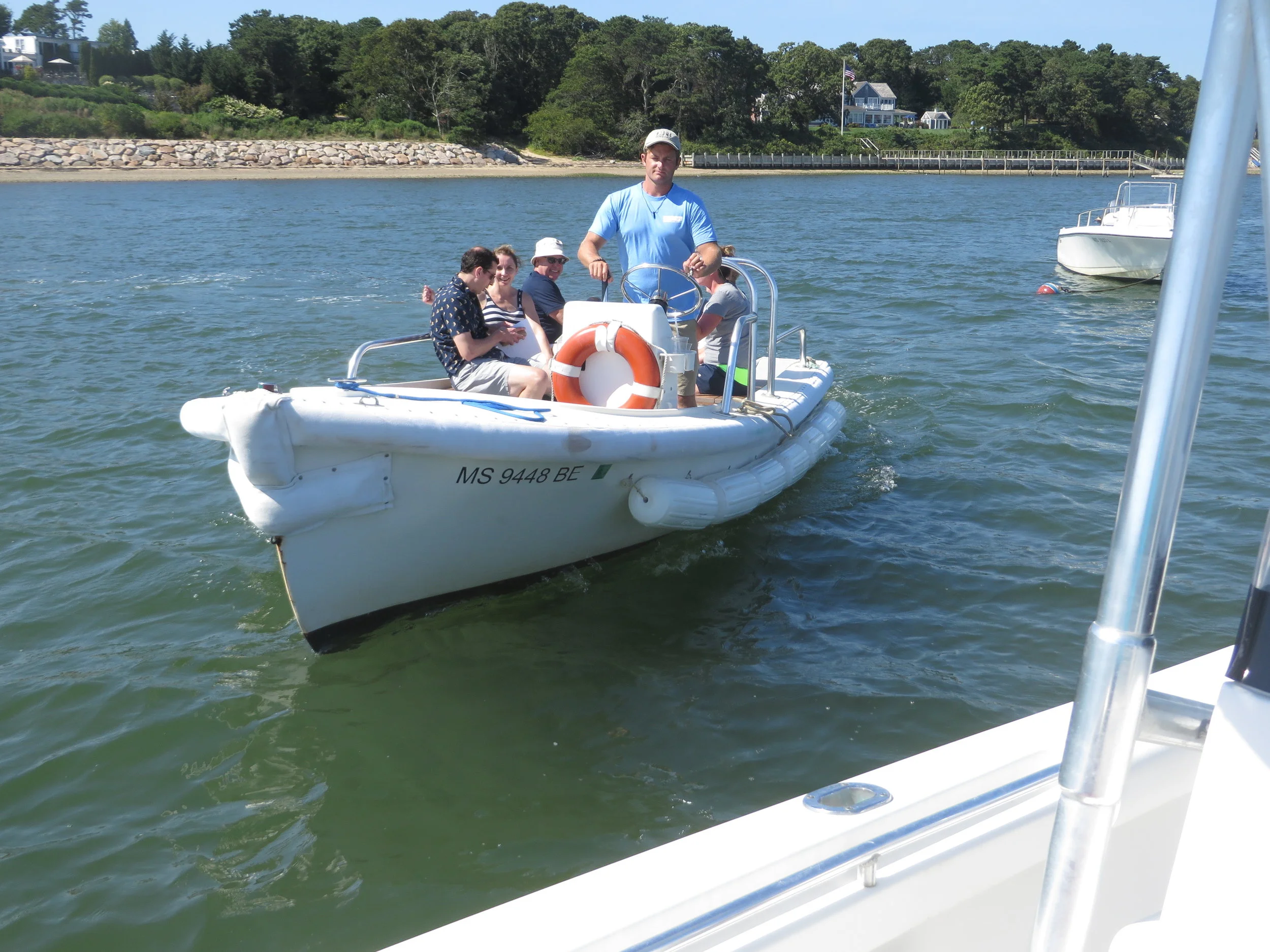 Our tour guests return to our boat via hotel water shuttle, after a wonderful day on the water and an exquisite lunch at the world famous Wequassett Inn.