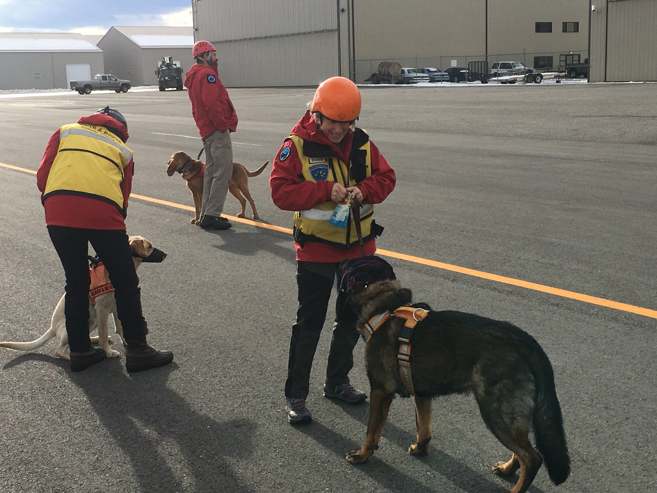  K9’s Telly, Jake, and Sabre (and their handlers) wait for their turn to load. 