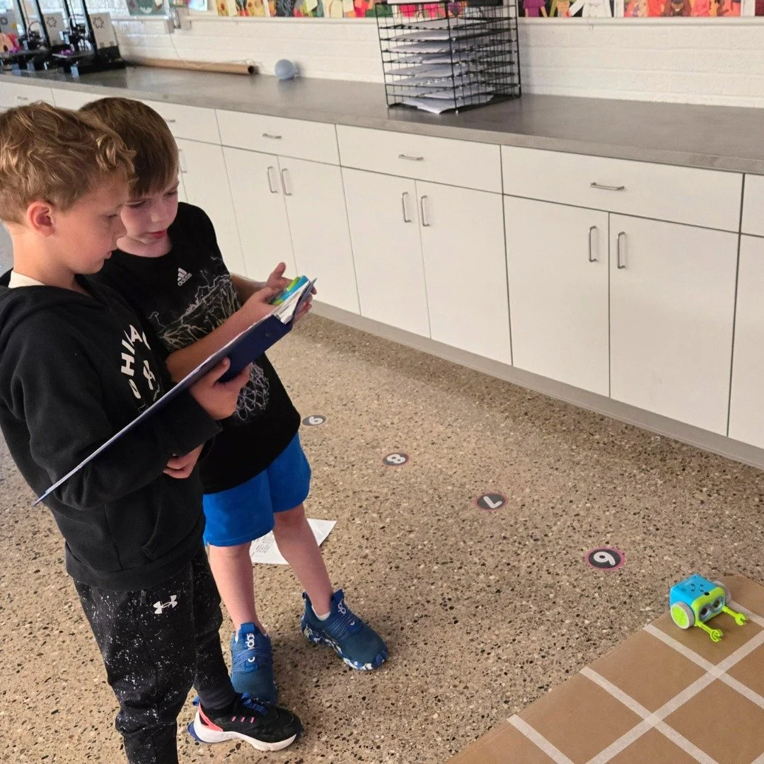 First graders have been having fun programming Botley the Robot. Students each had a role (rotating betweeen programmer, controller, engineer, and watcher) as they practiced sequencing commands they will use in future learning! #bccs #bccsfirstgrade