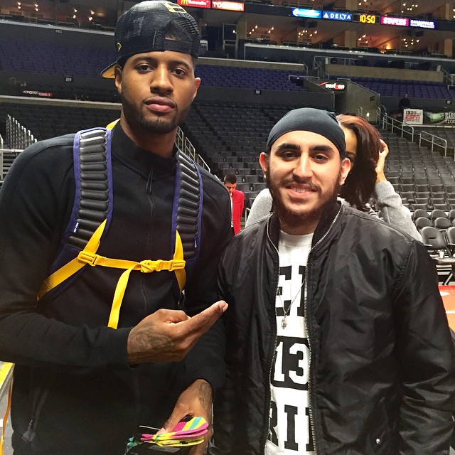 Veeraj with Paul George.jpg