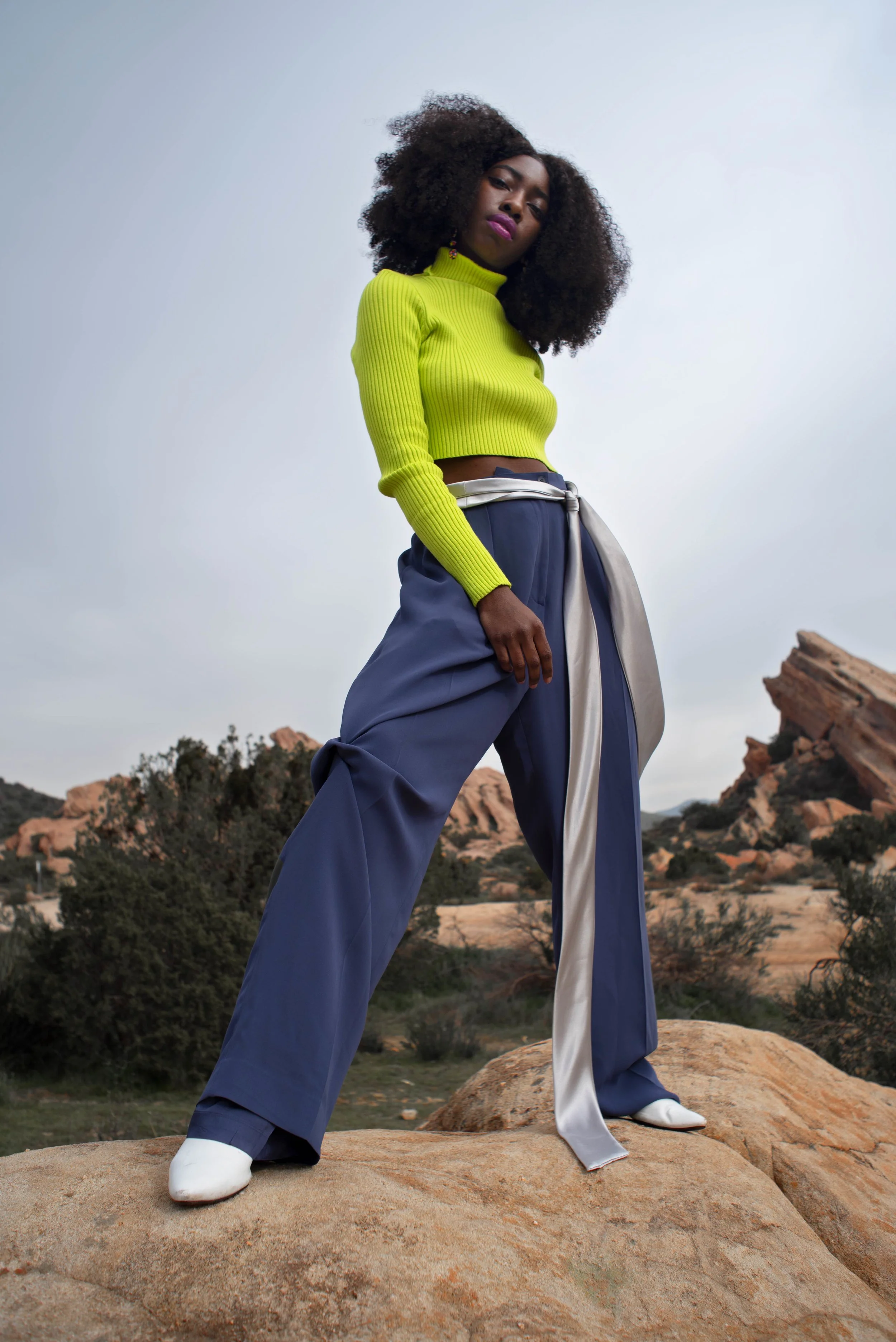   Team Credits   Photography: Graeme Aegerter  Model: Yolanda Redd  Creative Direction: T’keyah Bennett  Stylist: T’keyah Bennett  Assistant Stylist: Nandi George  Hair/Makeup: Yolanda Redd     Clothing Credits   Ribbed Cropped Turtleneck - Red Light