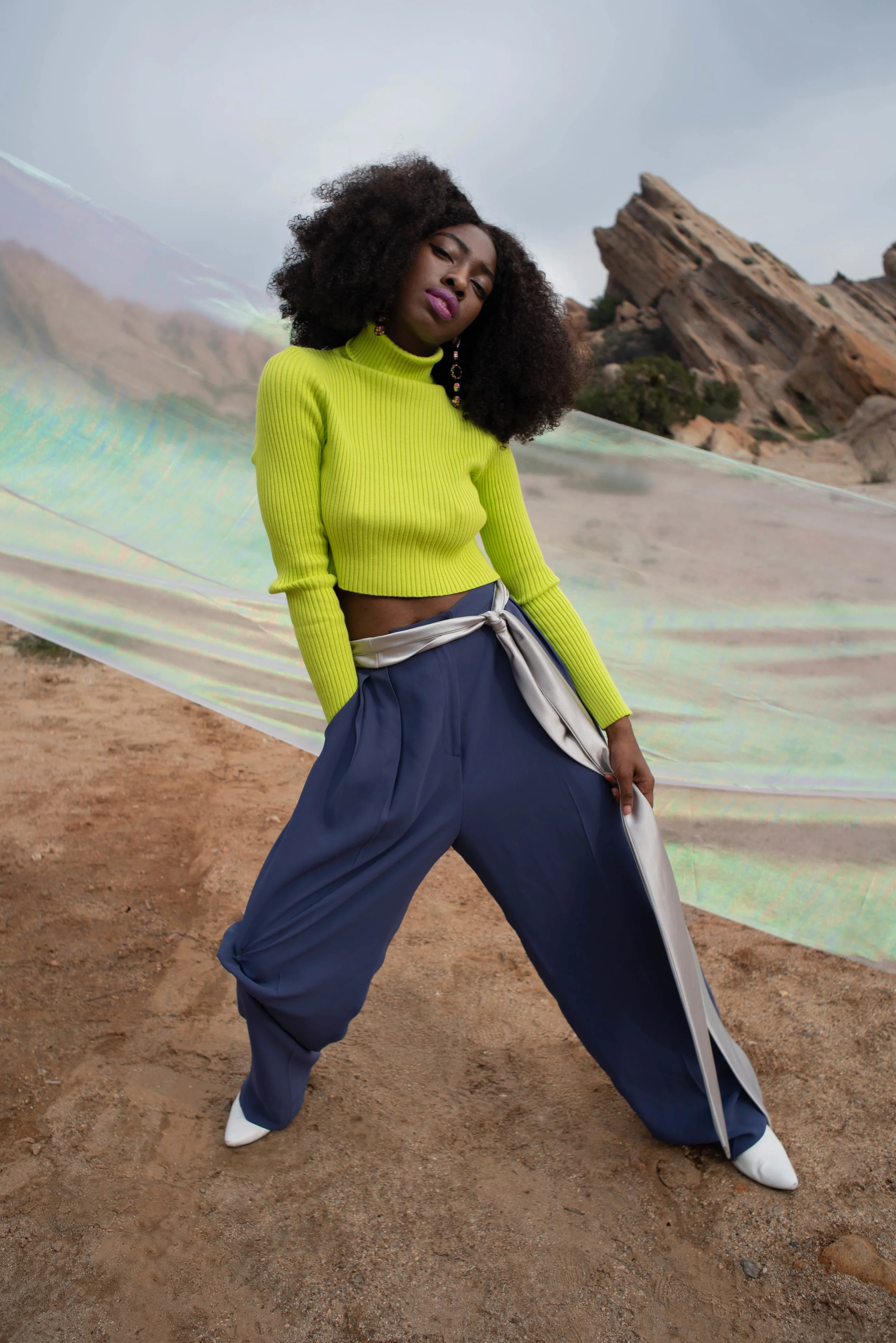   Team Credits   Photography: Graeme Aegerter  Model: Yolanda Redd  Creative Direction: T’keyah Bennett  Stylist: T’keyah Bennett  Assistant Stylist: Nandi George  Hair/Makeup: Yolanda Redd     Clothing Credits   Ribbed Cropped Turtleneck - Red Light