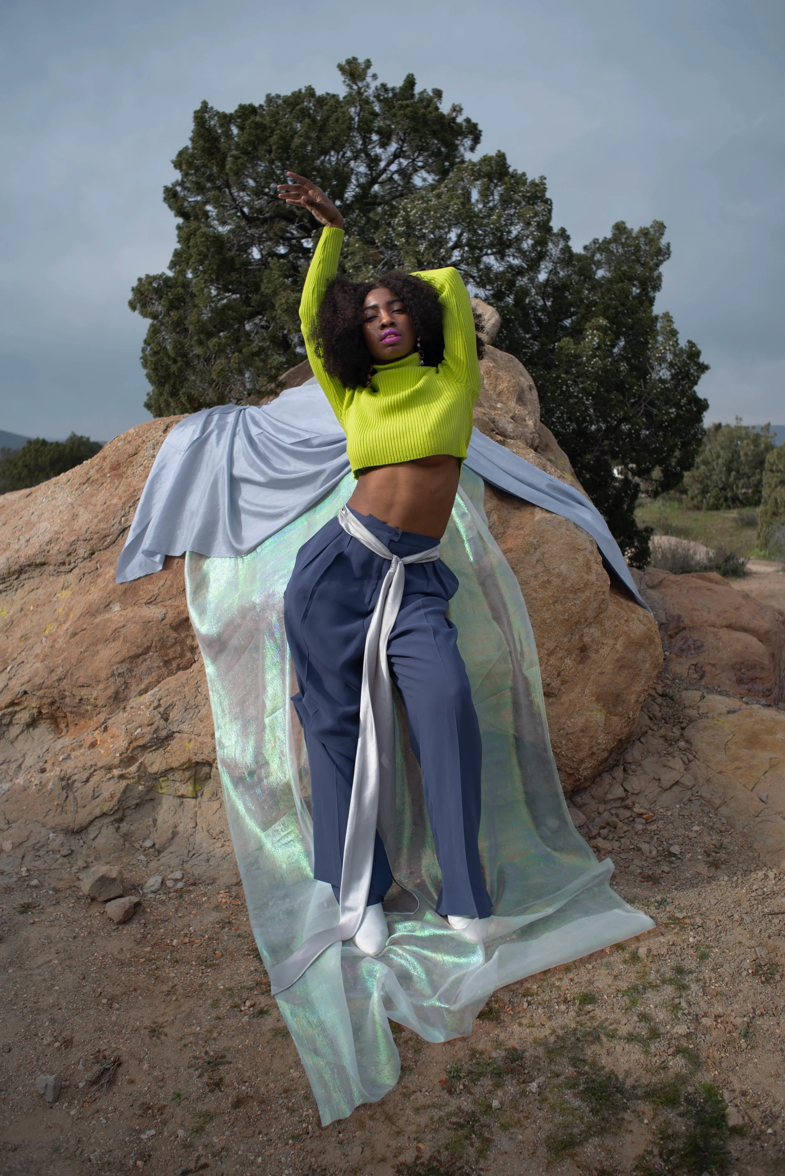   Team Credits   Photography: Graeme Aegerter  Model: Yolanda Redd  Creative Direction: T’keyah Bennett  Stylist: T’keyah Bennett  Assistant Stylist: Nandi George  Hair/Makeup: Yolanda Redd     Clothing Credits   Ribbed Cropped Turtleneck - Red Light