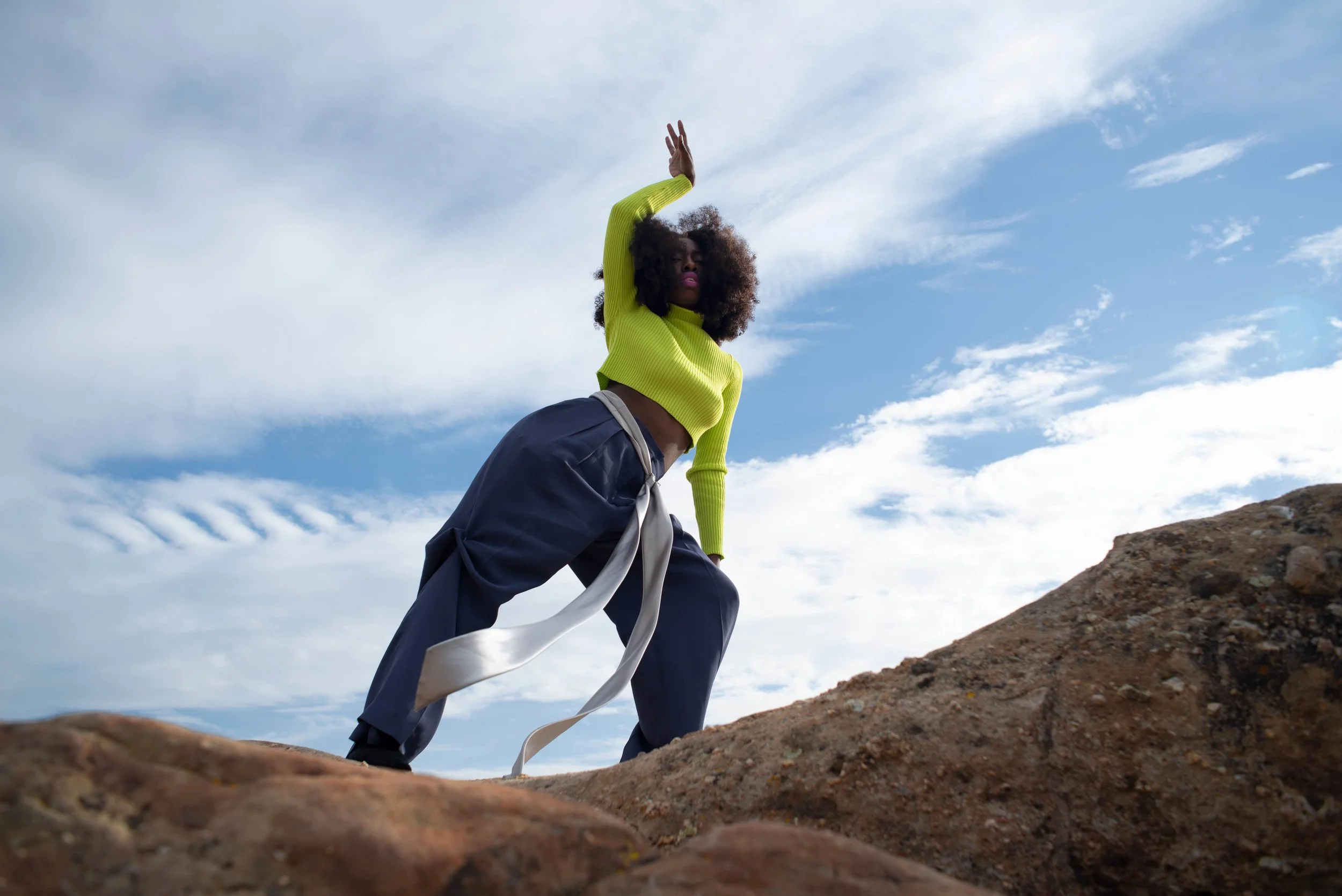   Team Credits   Photography: Graeme Aegerter  Model: Yolanda Redd  Creative Direction: T’keyah Bennett  Stylist: T’keyah Bennett  Assistant Stylist: Nandi George  Hair/Makeup: Yolanda Redd     Clothing Credits   Ribbed Cropped Turtleneck - Red Light