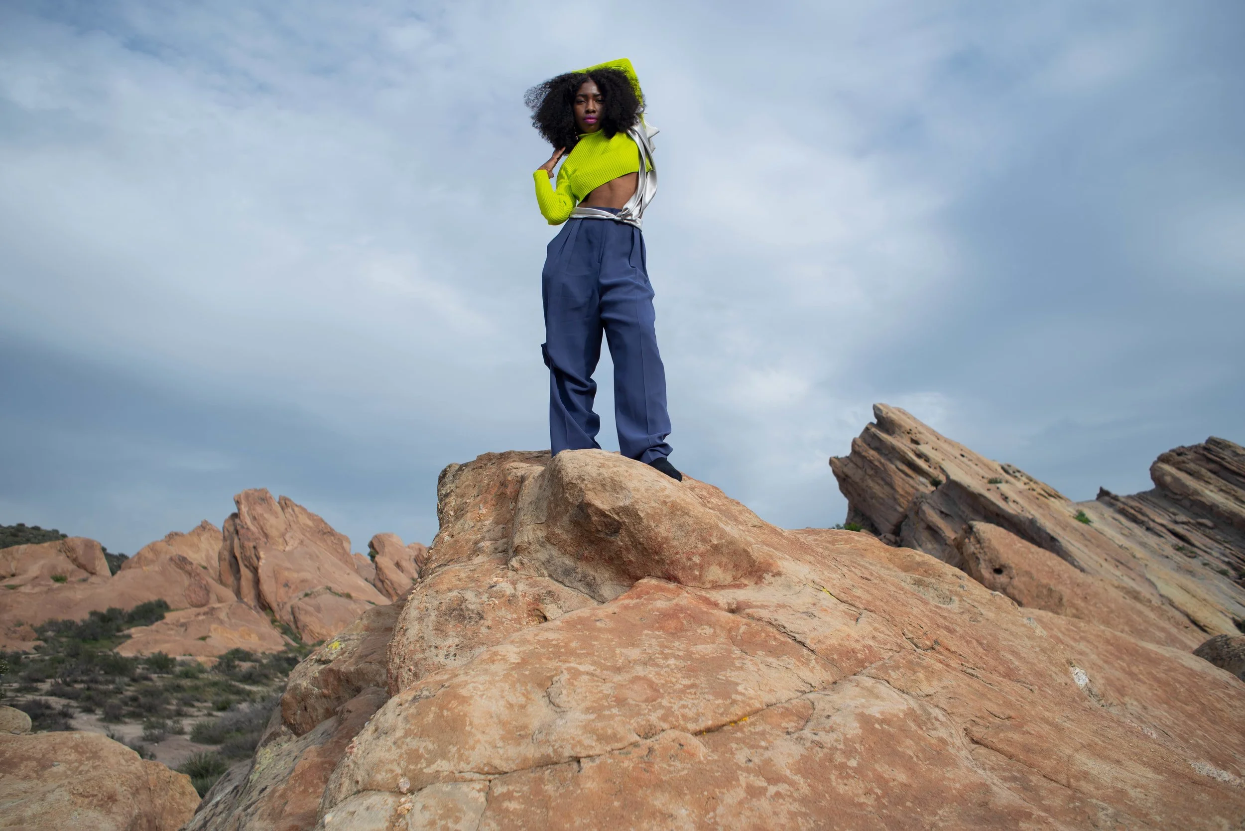   Team Credits   Photography: Graeme Aegerter  Model: Yolanda Redd  Creative Direction: T’keyah Bennett  Stylist: T’keyah Bennett  Assistant Stylist: Nandi George  Hair/Makeup: Yolanda Redd     Clothing Credits   Ribbed Cropped Turtleneck - Red Light