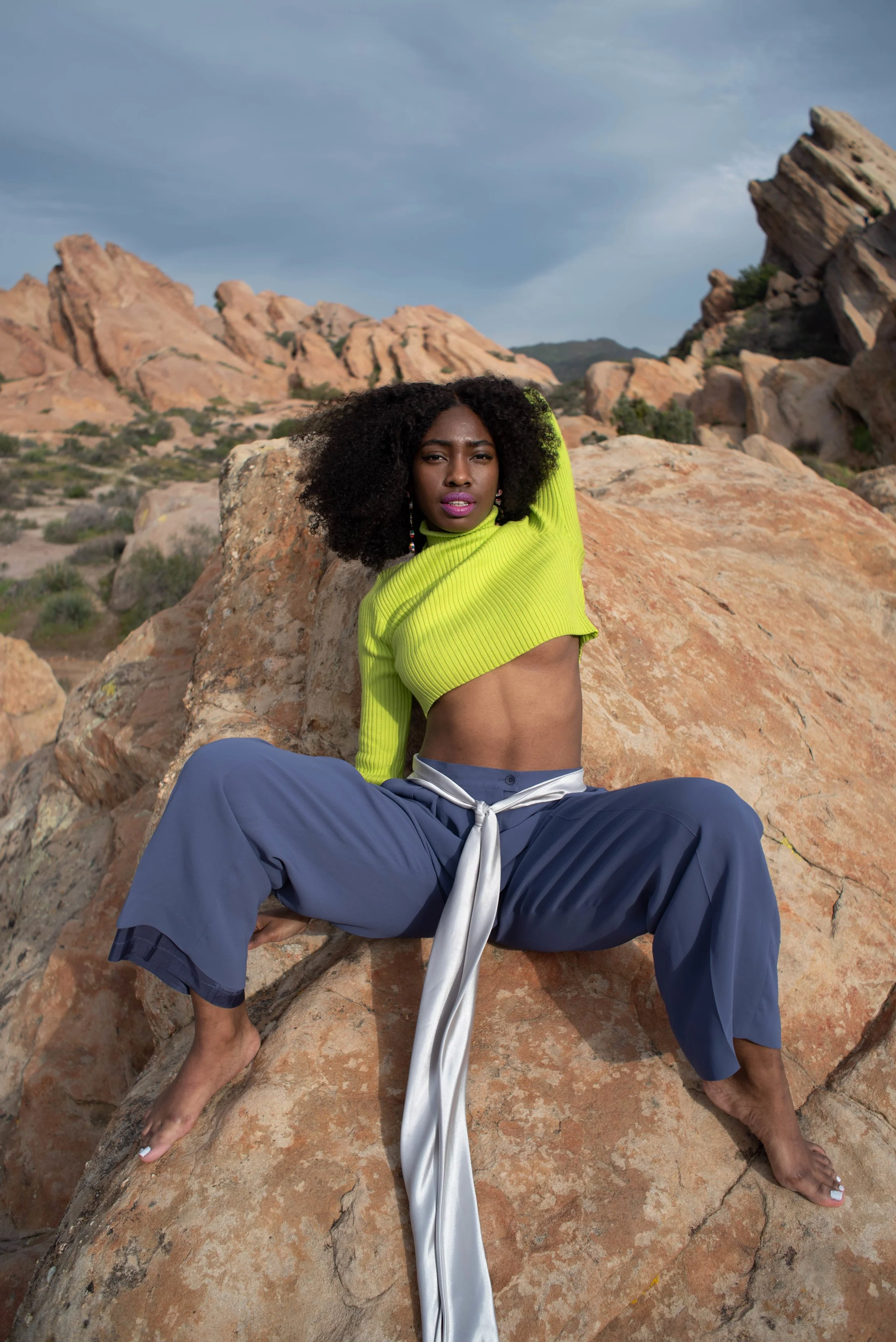   Team Credits   Photography: Graeme Aegerter  Model: Yolanda Redd  Creative Direction: T’keyah Bennett  Stylist: T’keyah Bennett  Assistant Stylist: Nandi George  Hair/Makeup: Yolanda Redd     Clothing Credits   Ribbed Cropped Turtleneck - Red Light
