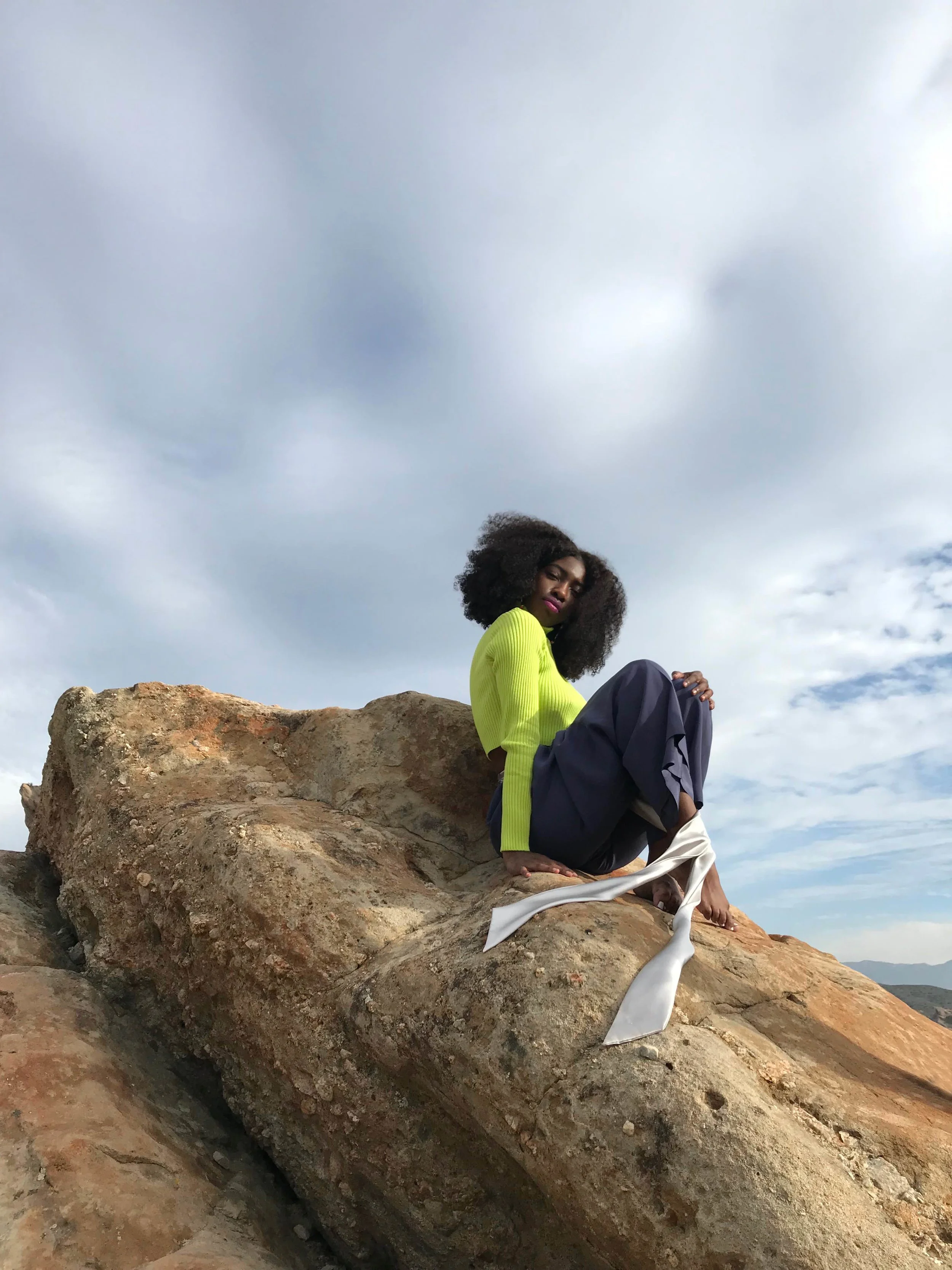   Team Credits   Photography: Graeme Aegerter  Model: Yolanda Redd  Creative Direction: T’keyah Bennett  Stylist: T’keyah Bennett  Assistant Stylist: Nandi George  Hair/Makeup: Yolanda Redd     Clothing Credits   Ribbed Cropped Turtleneck - Red Light