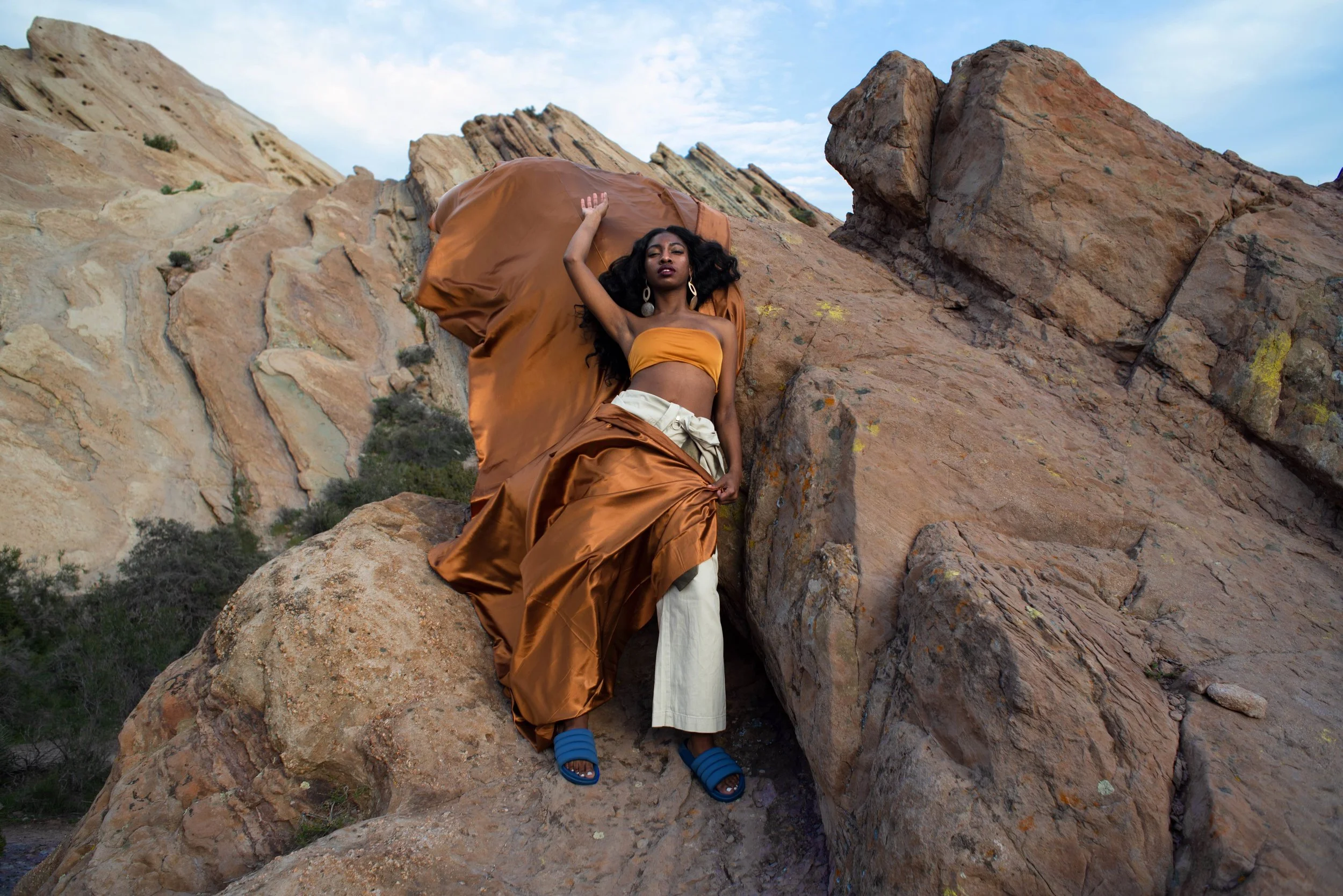   Team Credits   Photography: Graeme Aegerter  Model: Yolanda Redd  Creative Direction: T’keyah Bennett  Stylist: T’keyah Bennett  Assistant Stylist: Nandi George  Hair/Makeup: Yolanda Redd    Clothing Credits:   Statement Resin Circle Earrings - ASO