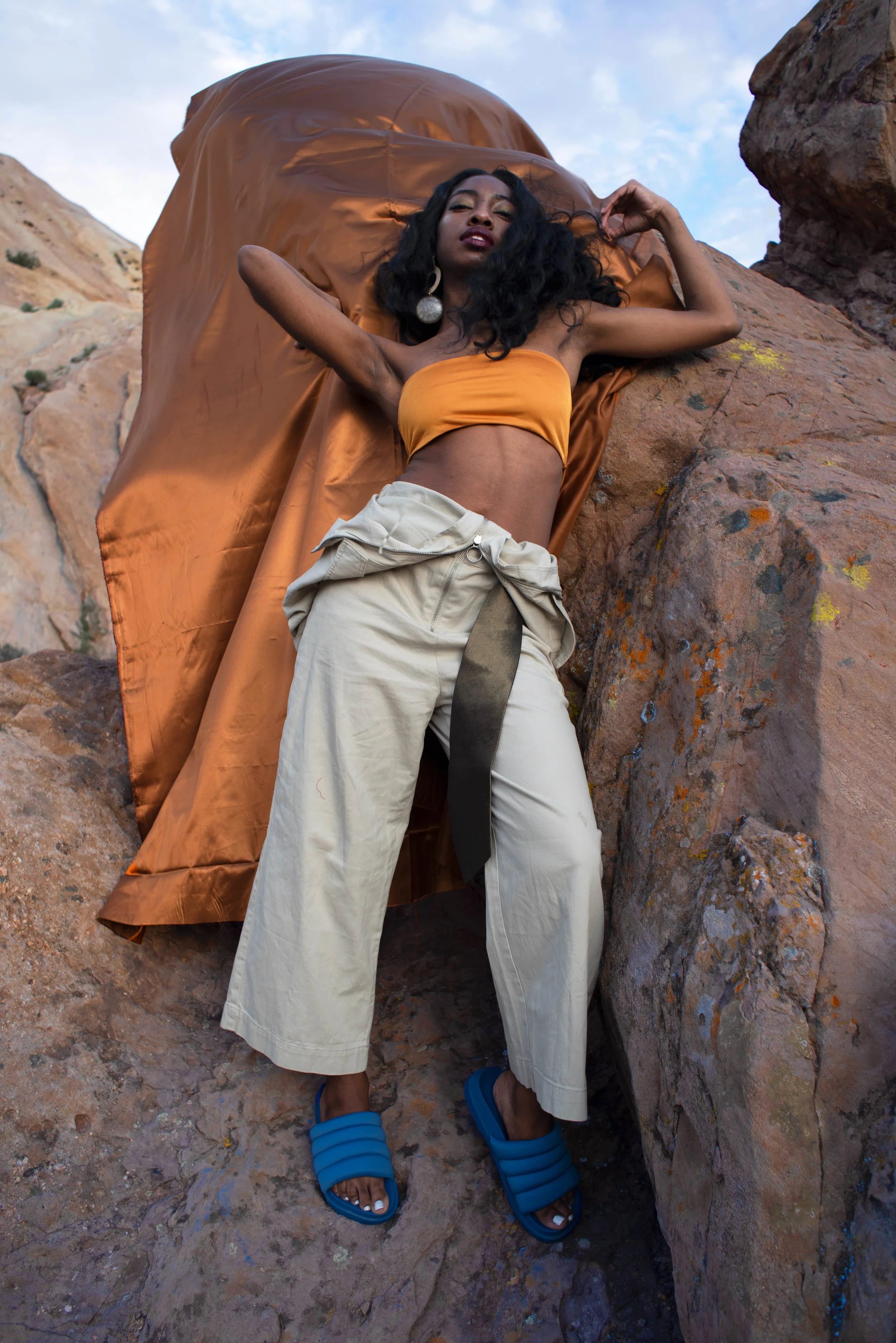   Team Credits   Photography: Graeme Aegerter  Model: Yolanda Redd  Creative Direction: T’keyah Bennett  Stylist: T’keyah Bennett  Assistant Stylist: Nandi George  Hair/Makeup: Yolanda Redd    Clothing Credits:   Statement Resin Circle Earrings - ASO