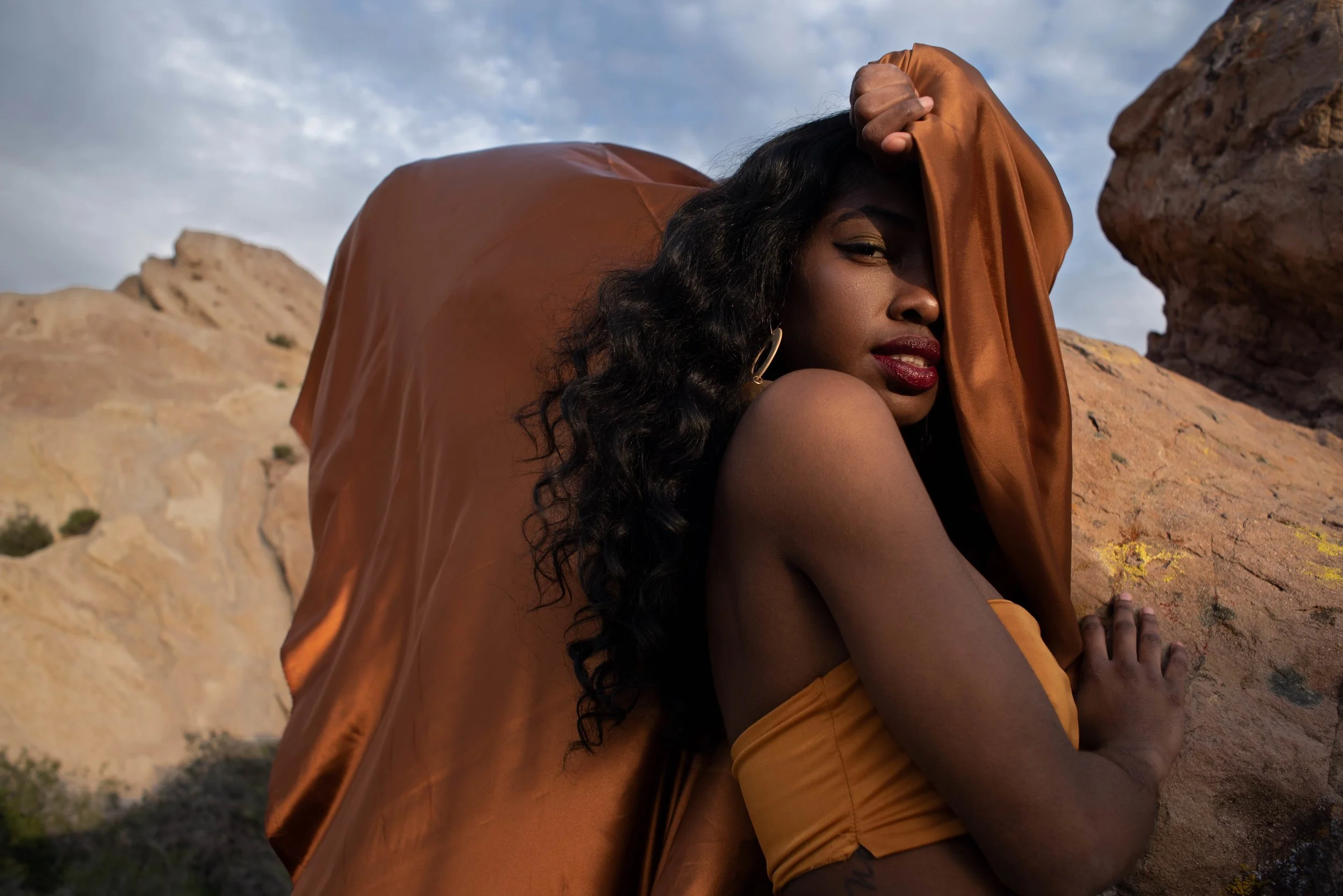   Team Credits   Photography: Graeme Aegerter  Model: Yolanda Redd  Creative Direction: T’keyah Bennett  Stylist: T’keyah Bennett  Assistant Stylist: Nandi George  Hair/Makeup: Yolanda Redd    Clothing Credits:   Statement Resin Circle Earrings - ASO