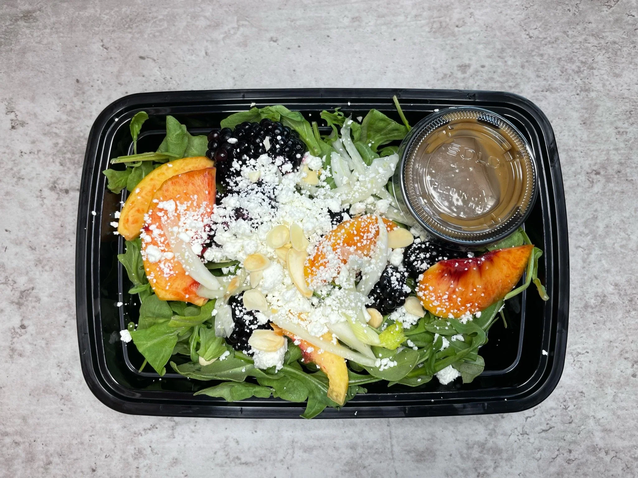 Fresh Local Peach & Blackberry Organic Spinach Salad, Shaved Fennel, Toasted Almonds, Crumbled Goat Cheese, Honey Basil Balsamic Vinaigrette (can add Grilled Chicken)
