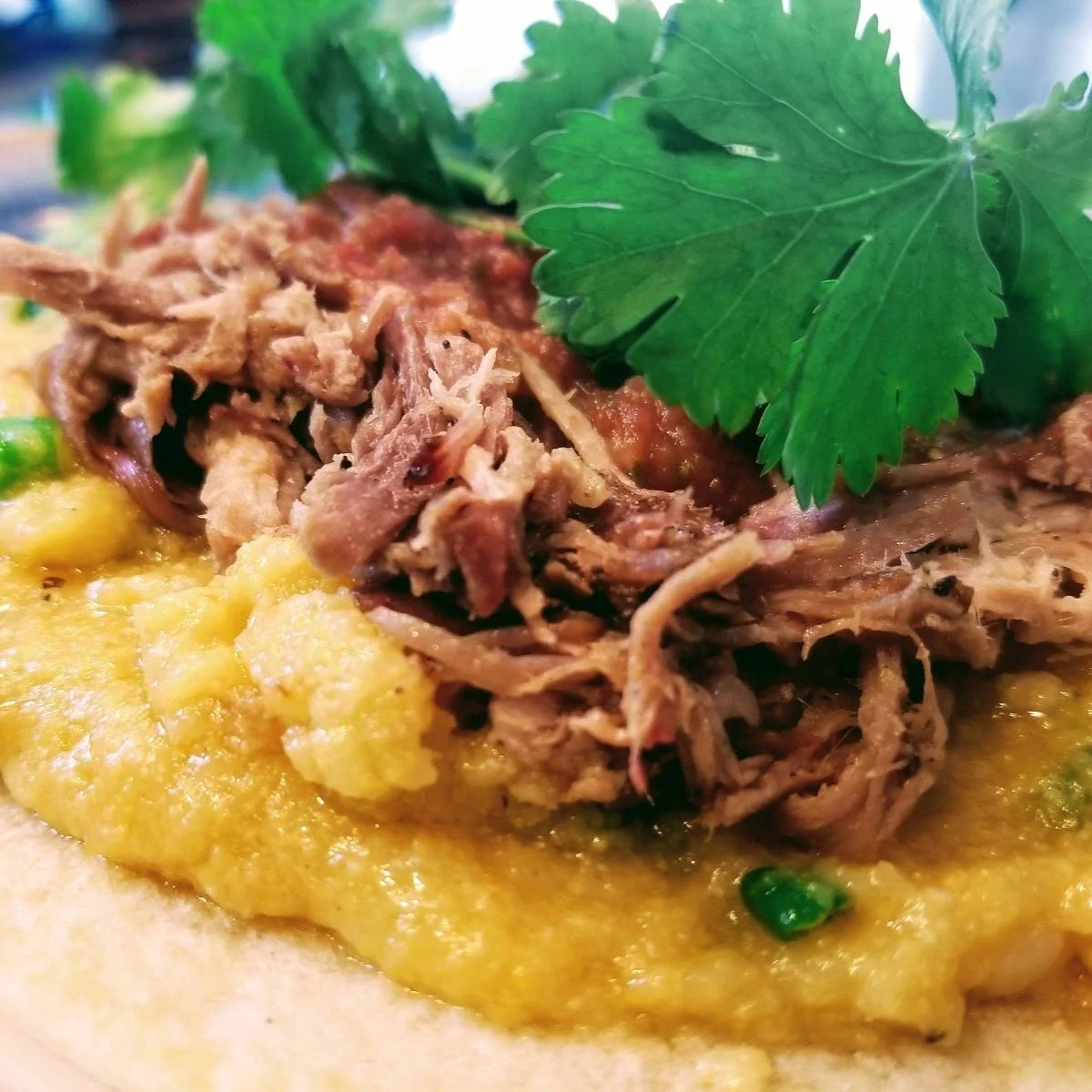 Local Stone Ground Grits Bowl, Slow Braised Carnitas, Roasted Pepper & Onions, Scrambled Eggs, Queso Fresco, Noah's Guacamole, Fresh Pico De Gallo
