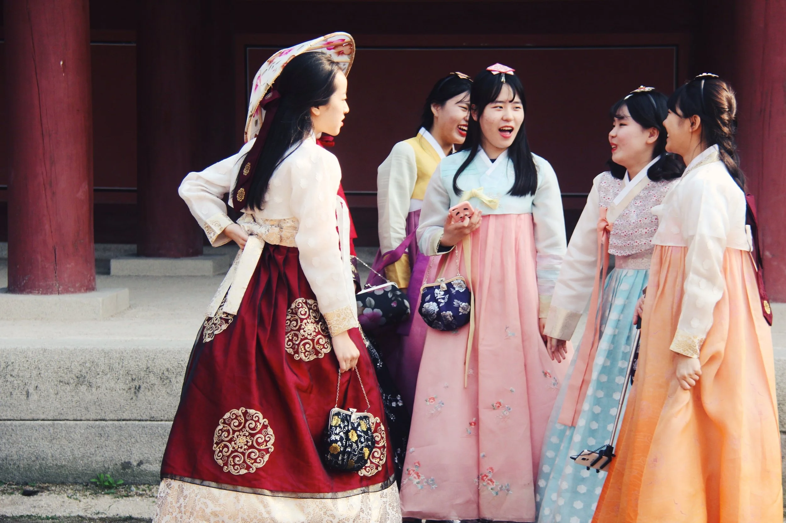 Young girls in rented hanbok enjoy their time at Gyeongbokgung.