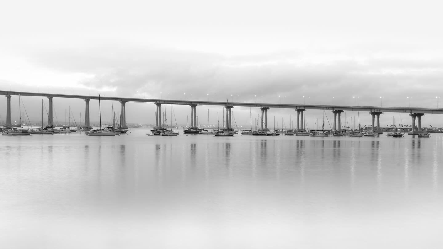 Come sail away with me! #coronadobaybridge #coronadoisland #bridge #coronadobridge #sandiego #sailboats #morningphotography #blackandwhitephotography #bnwphoto #blackandwhiteart #coronado #coronadosailboats