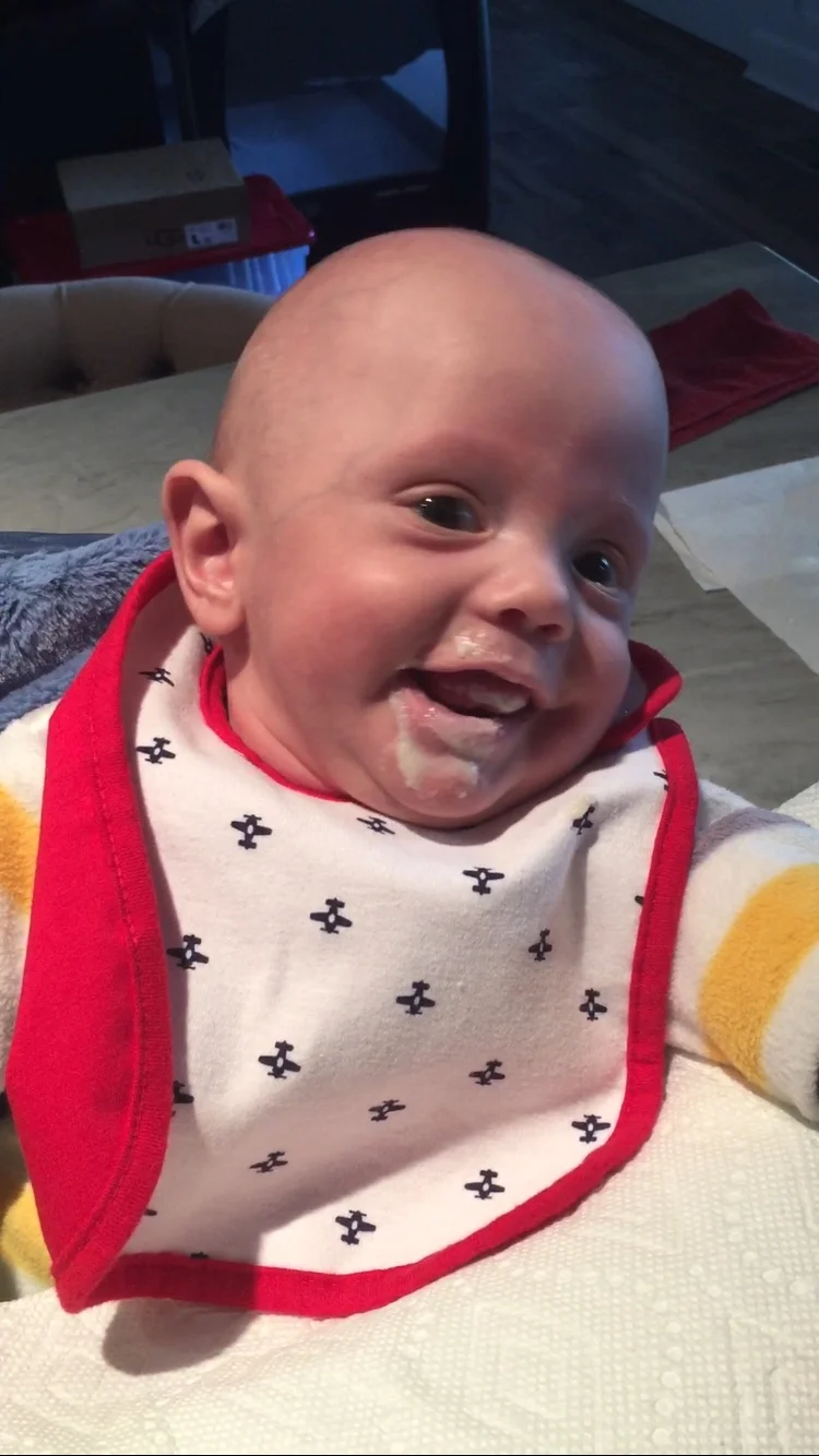 First spoon feeding - rice cereal beats a bottle anyway! 