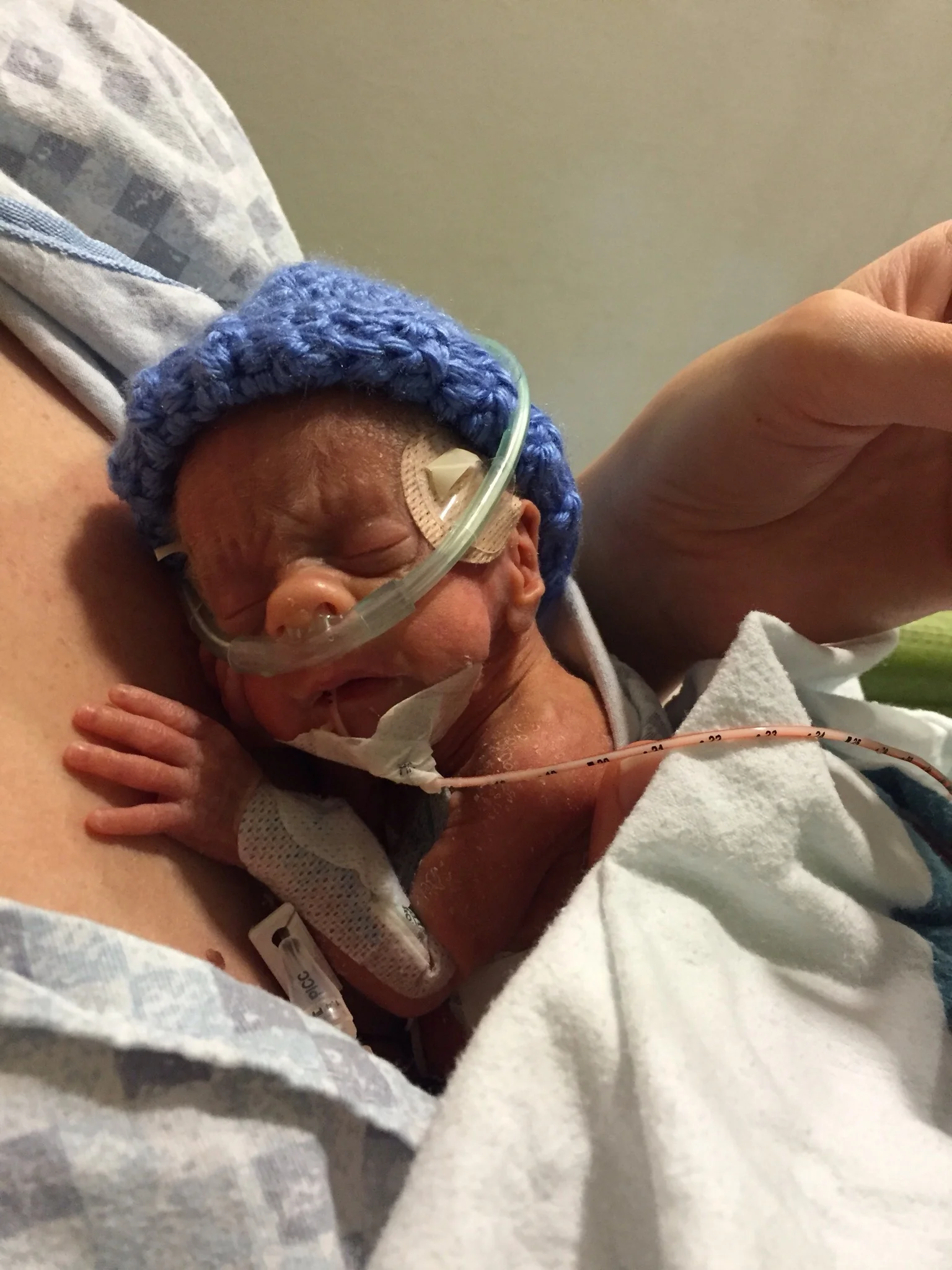  Holding 2lb baby Conner for the first time at 42 days old!