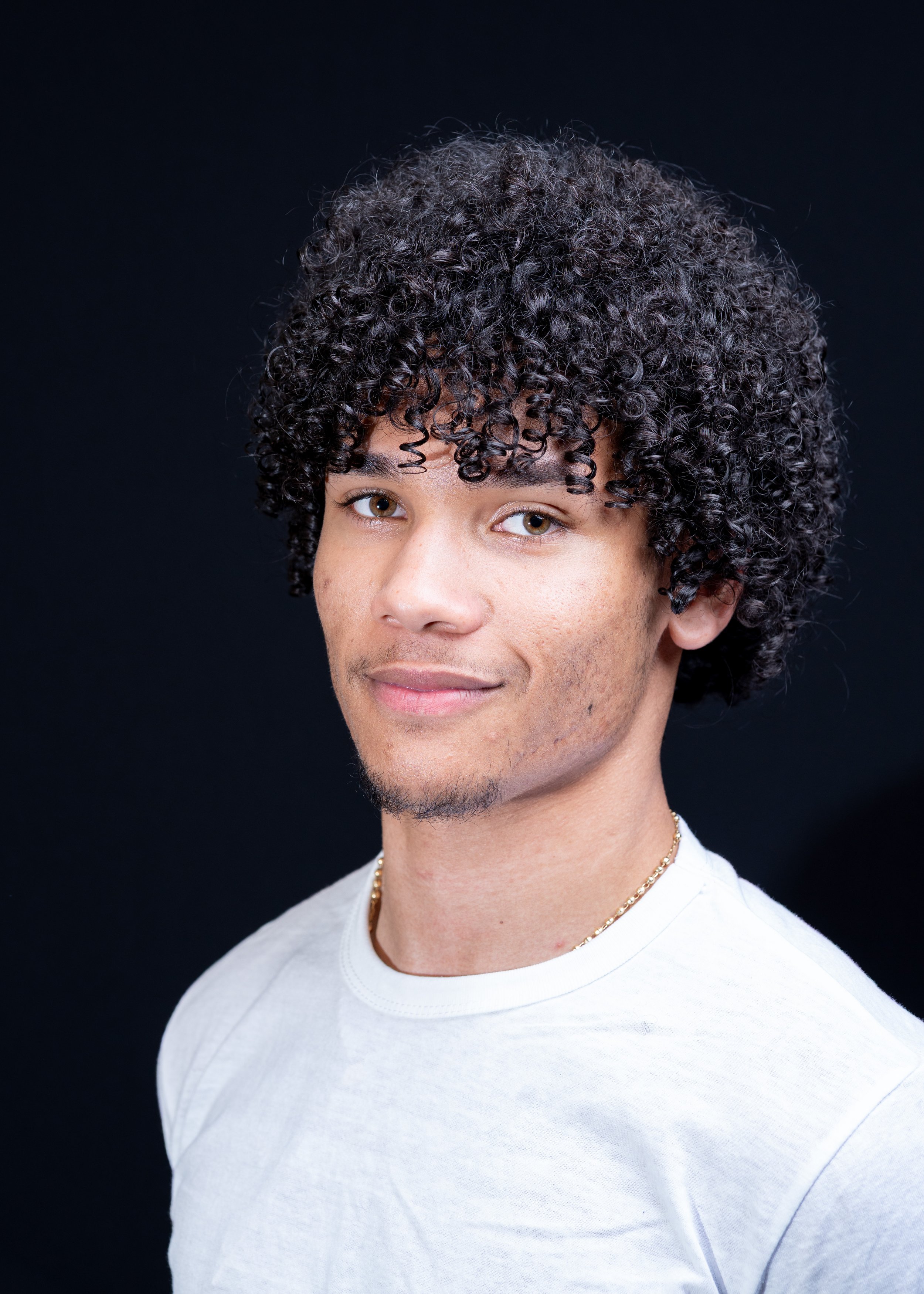 Headshots at Western Connecticut State University, for a panel event "Analysis in Action". A bCollege student posing for his business profile headshots.