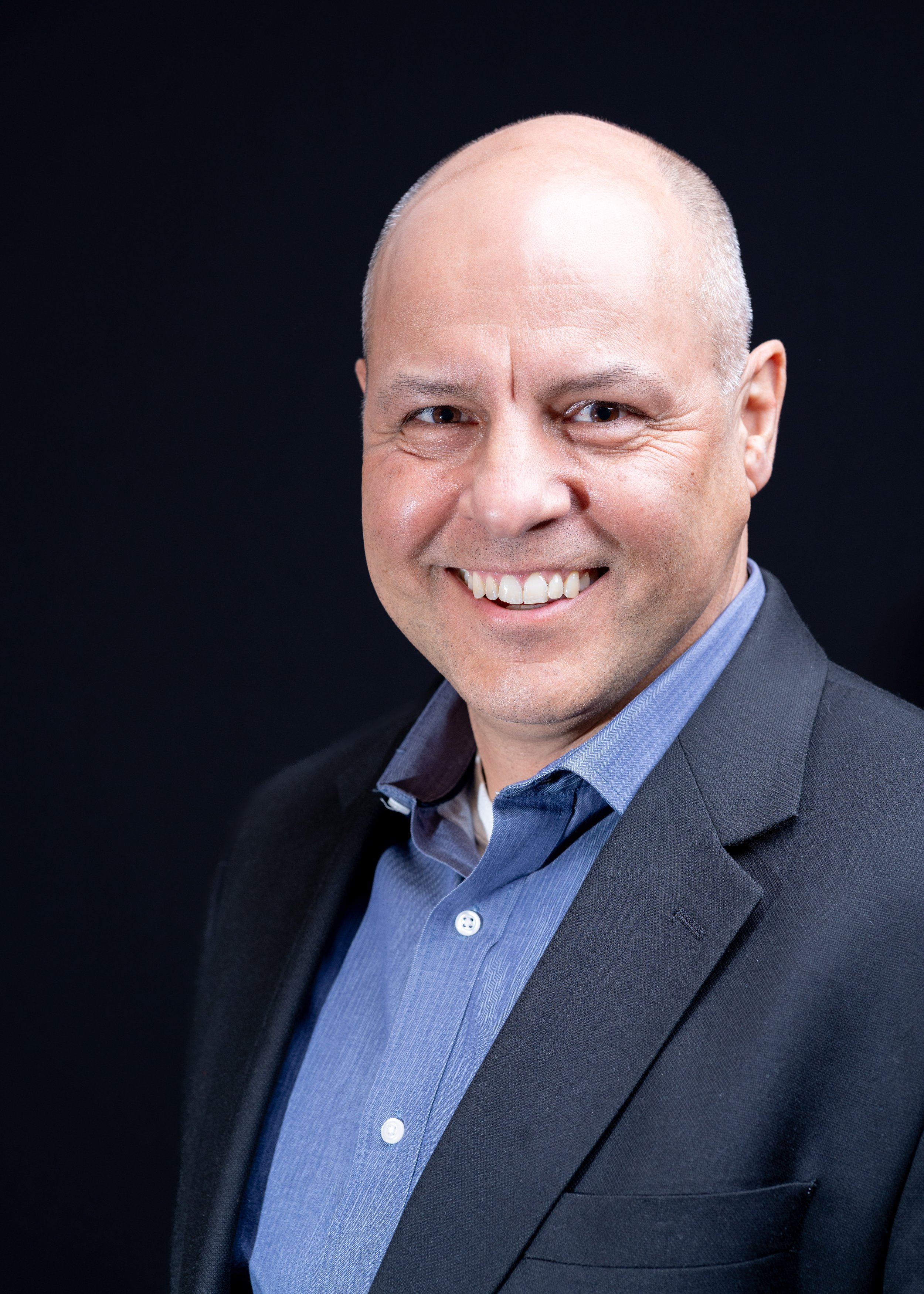 Headshots at Western Connecticut State University, for a panel event "Analysis in Action". A business professional posing for his business profile headshots.