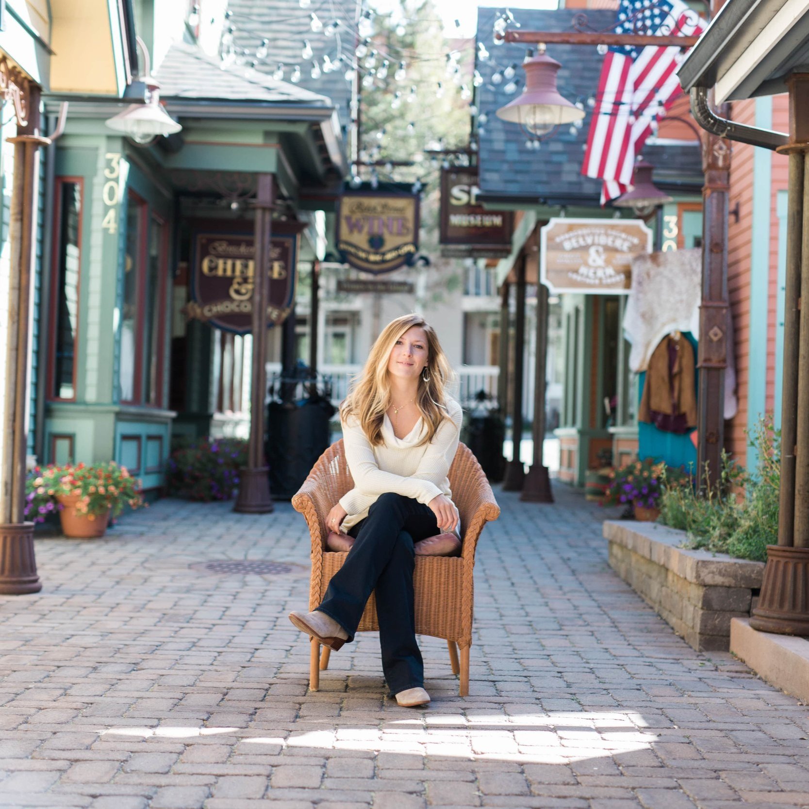 Allie Horner sitting in chair near shops