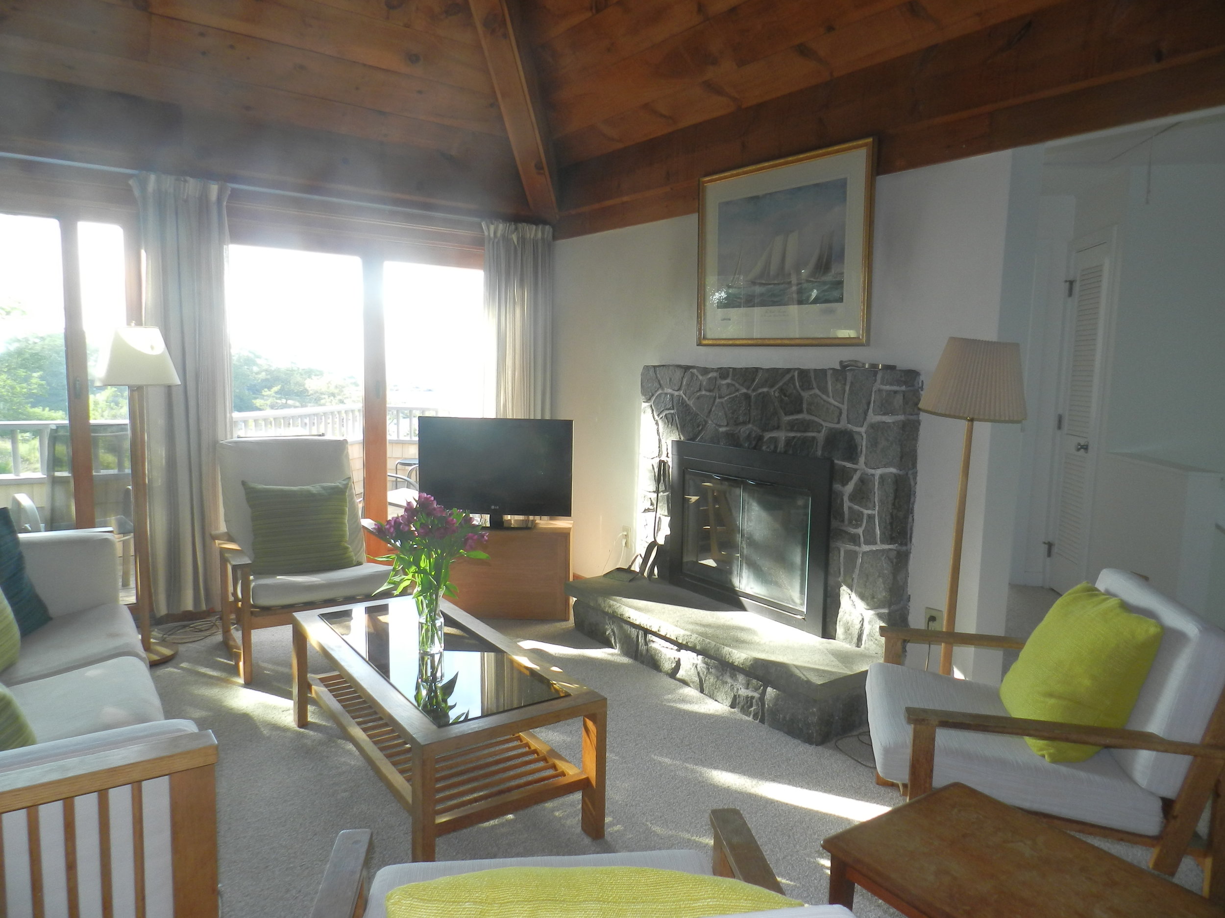  Living area, with working fireplace and Charles Webb furniture. (Note that in these interior photos, the ocean view is obscured by glare — the deck pictures &amp; the videos give a more accurate idea of the view both from inside and outside.) 