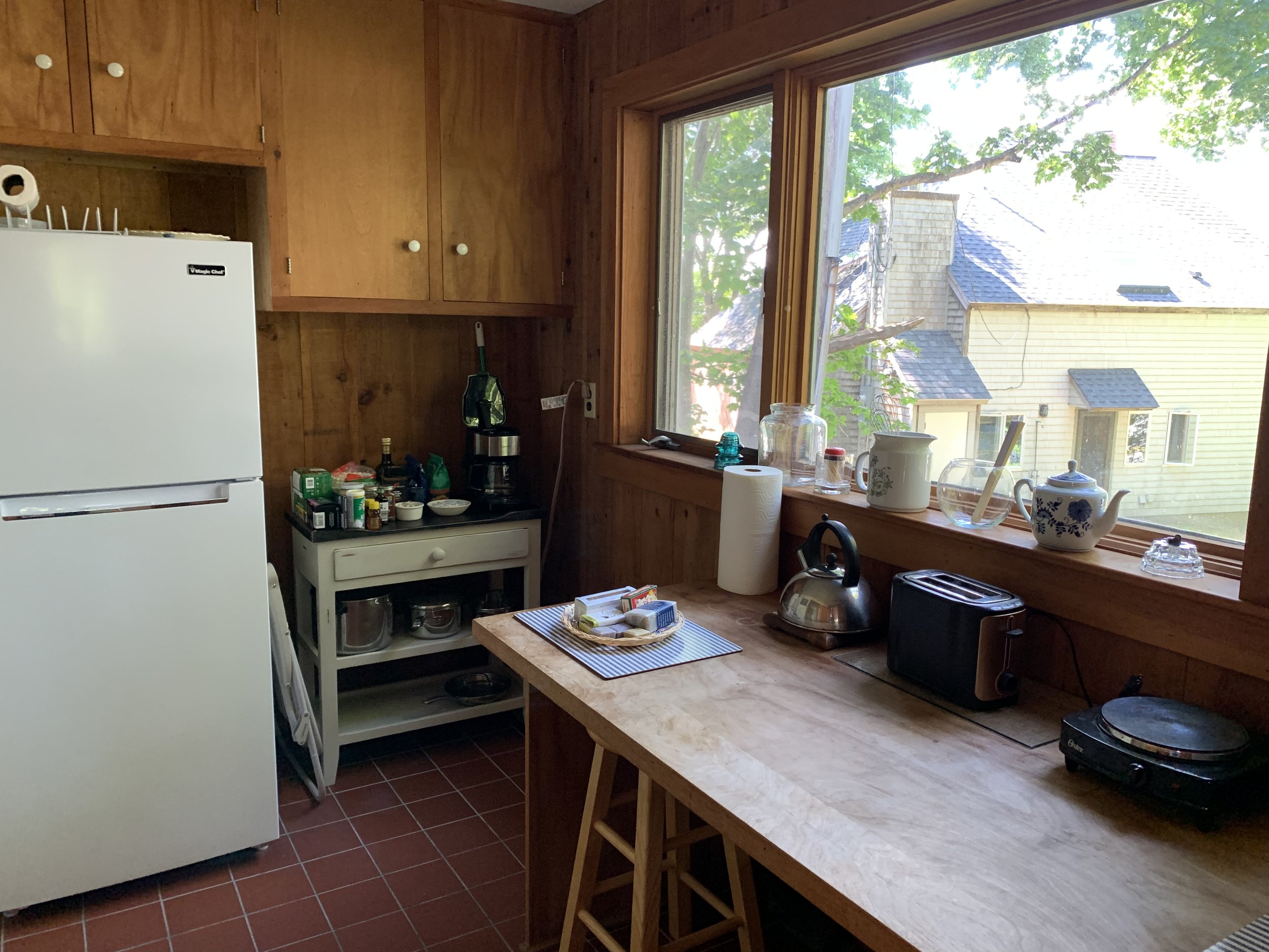  Small kitchen includes two hot plates, coffee maker, and toaster oven (out of frame here at right) 