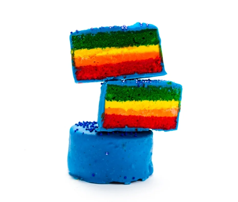 Rainbow The PRIDE of the Ring Ding Bar. This rainbow almond pound cake features multi-colored layers of creamy vanilla filling, all dipped in blue chocolate. Our snack cakes are for everyone!