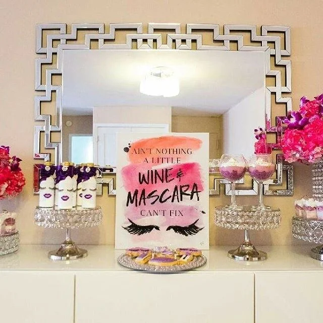AIN&rsquo;T NOTHING A LITTLE WINE AND MASCARA CAN&rsquo;T FIX!!! 💜🍷🎉 #RoyalBashEvents #RoyalBashEventsNYC #CholeandKimmy #Eventplanner #EventplanningNYC #GirlsNight #WineNight #LadiesNight #Wine #Mascara #Sweettable #flowerarrangements #MoscatoBottles #Glasses #Mirror #Donutwall #Cookies #Lashes #Sweets #coveredstrawberries #Lashescake #pillow #diy #pinkandpurple