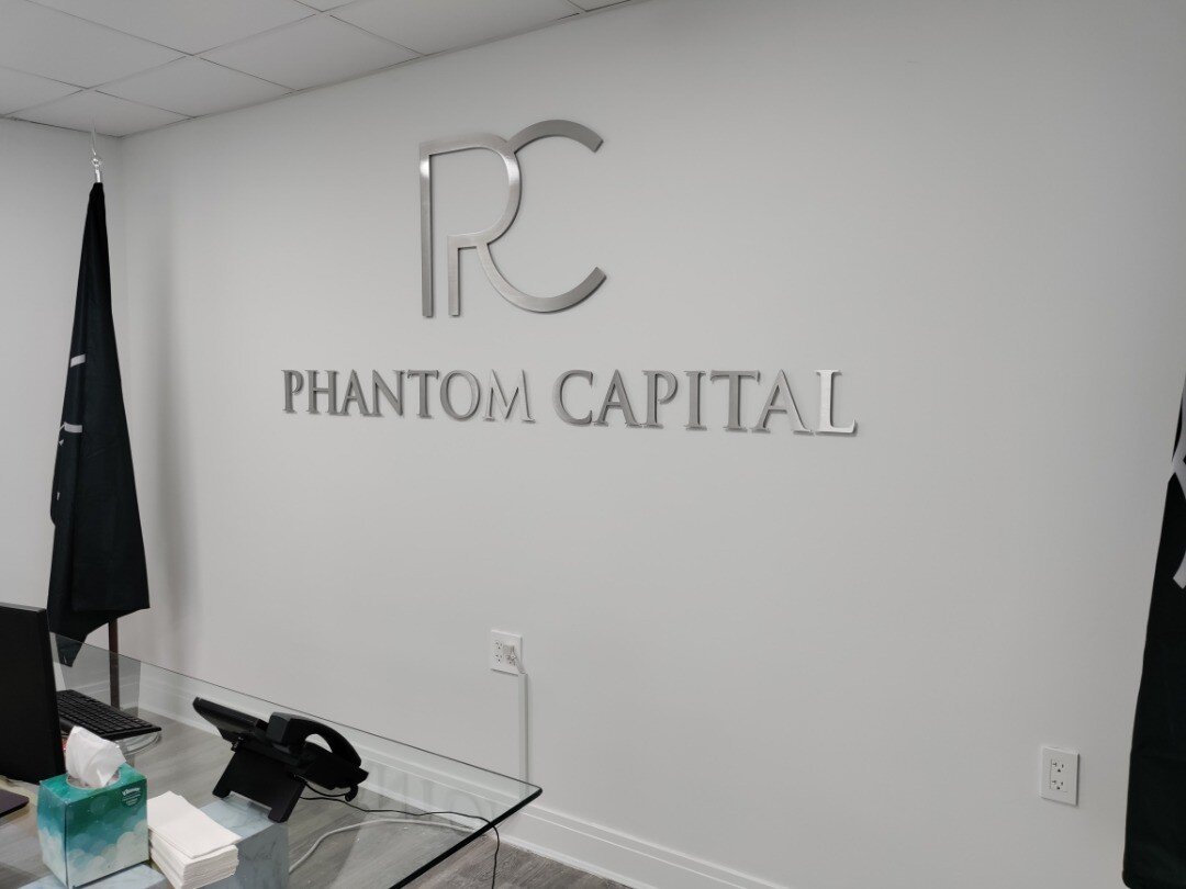 1/4&quot; thick brushed satin silver aluminum metal letters and logo pin-mounted to interior office drywall with 1/4&quot; spacers floating. #interiors #officeinteriors #corporateinteriors #interiordesign #commercialdesign #commercialinteriordesign #