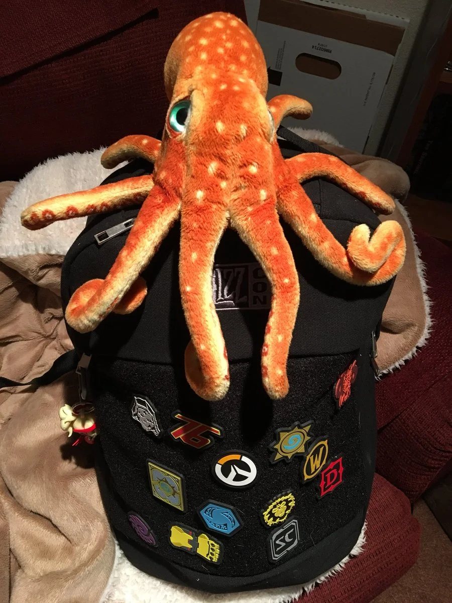 Corndog trying to make his escape on Kelly's backpack. And he would have gotten away with it too!