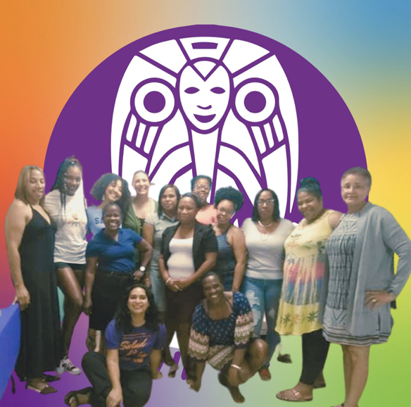 Group of women posing in front of a colorful backdrop with a large logo of a stylized face with a crown and circular designs.