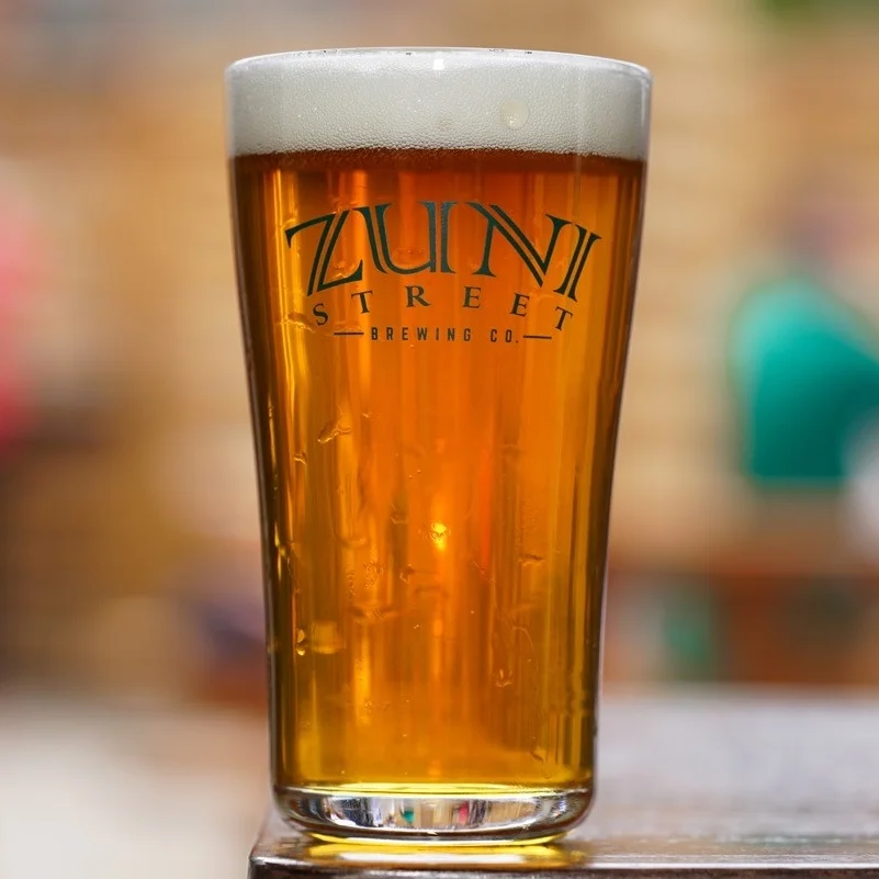 ZUNI STREET IPA ABV: 7.7% IBU: 45 A bright, hoppy offering, packed with flavors of citrus and tropical fruit. Full bodied and smooth, this beer is well balanced and drinkable to no end.