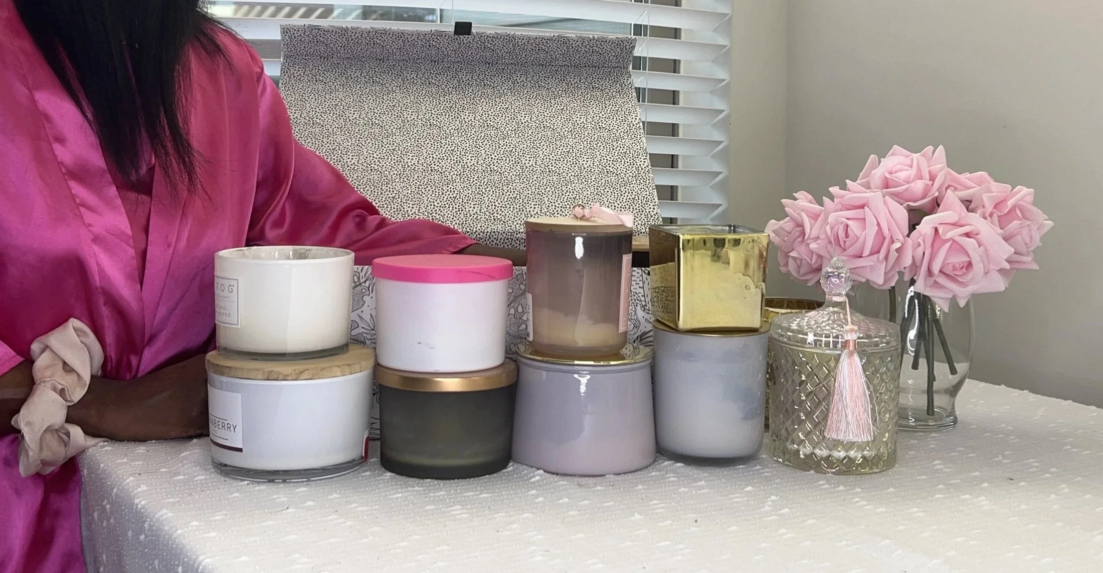 Stack of luxury candles by the window
