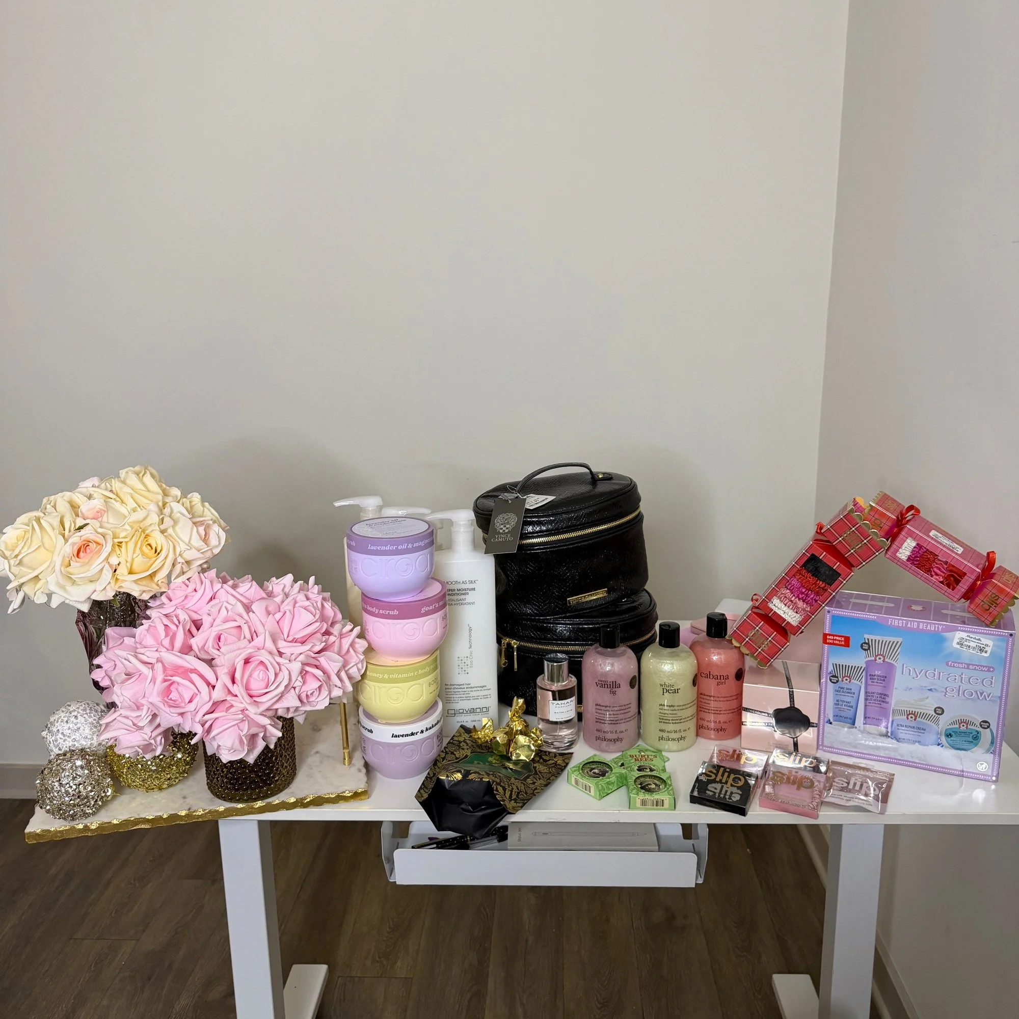 Marshalls beauty and home haul on a table with pink roses