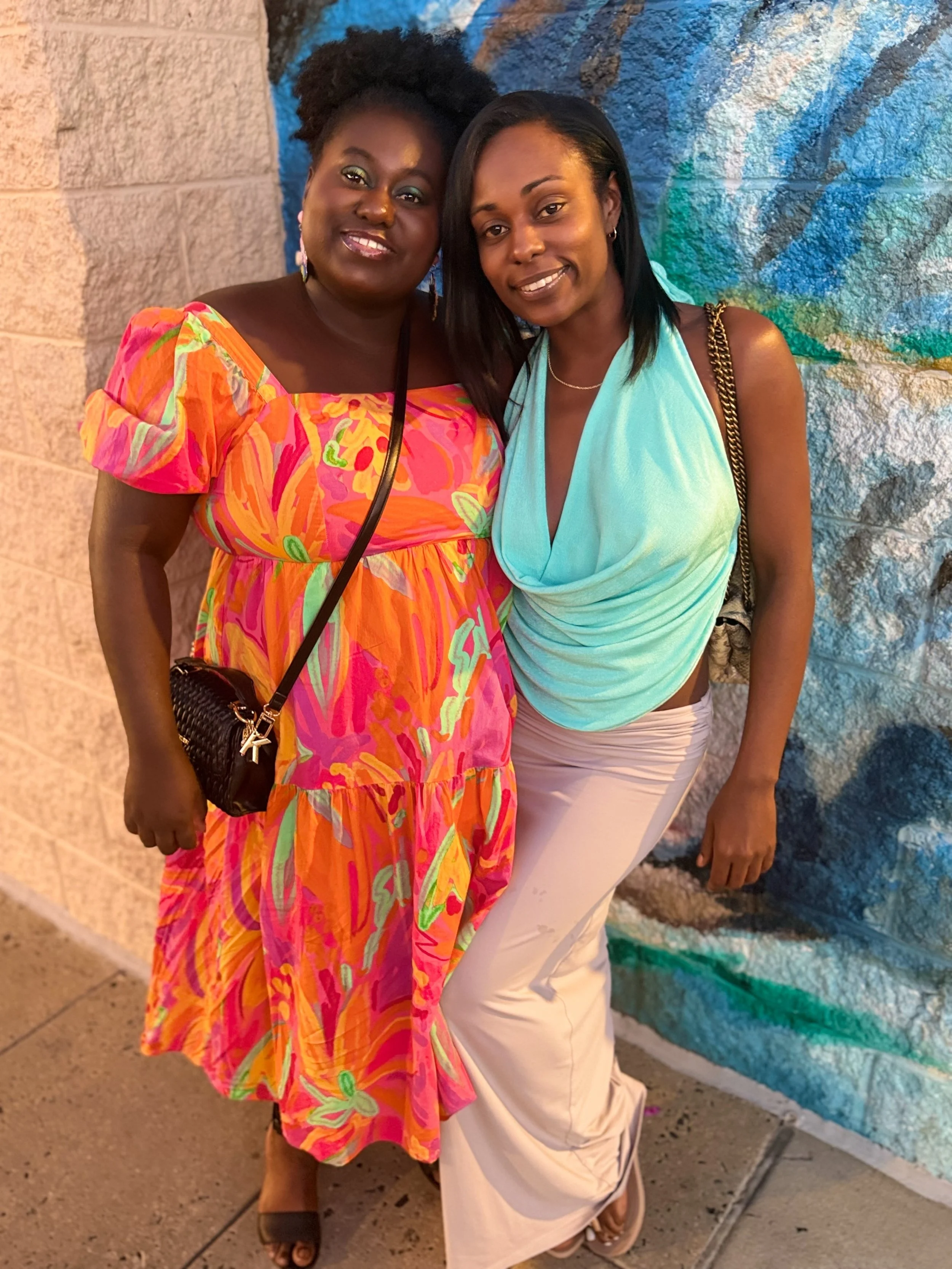 Brielle with her sister during a Leo season birthday celebration.