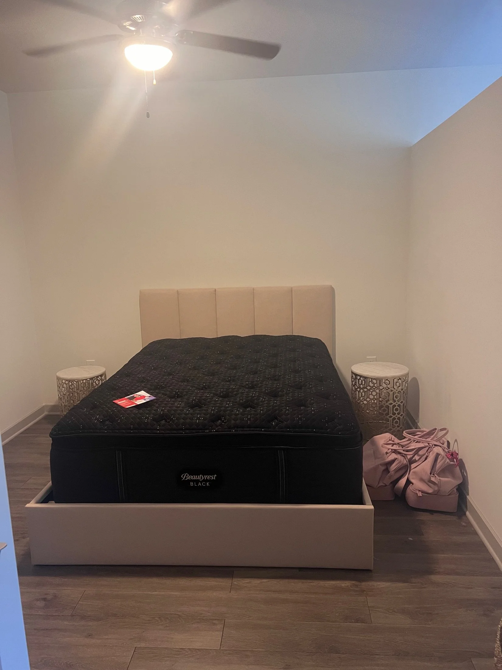 New mattress on an upholstered bed frame