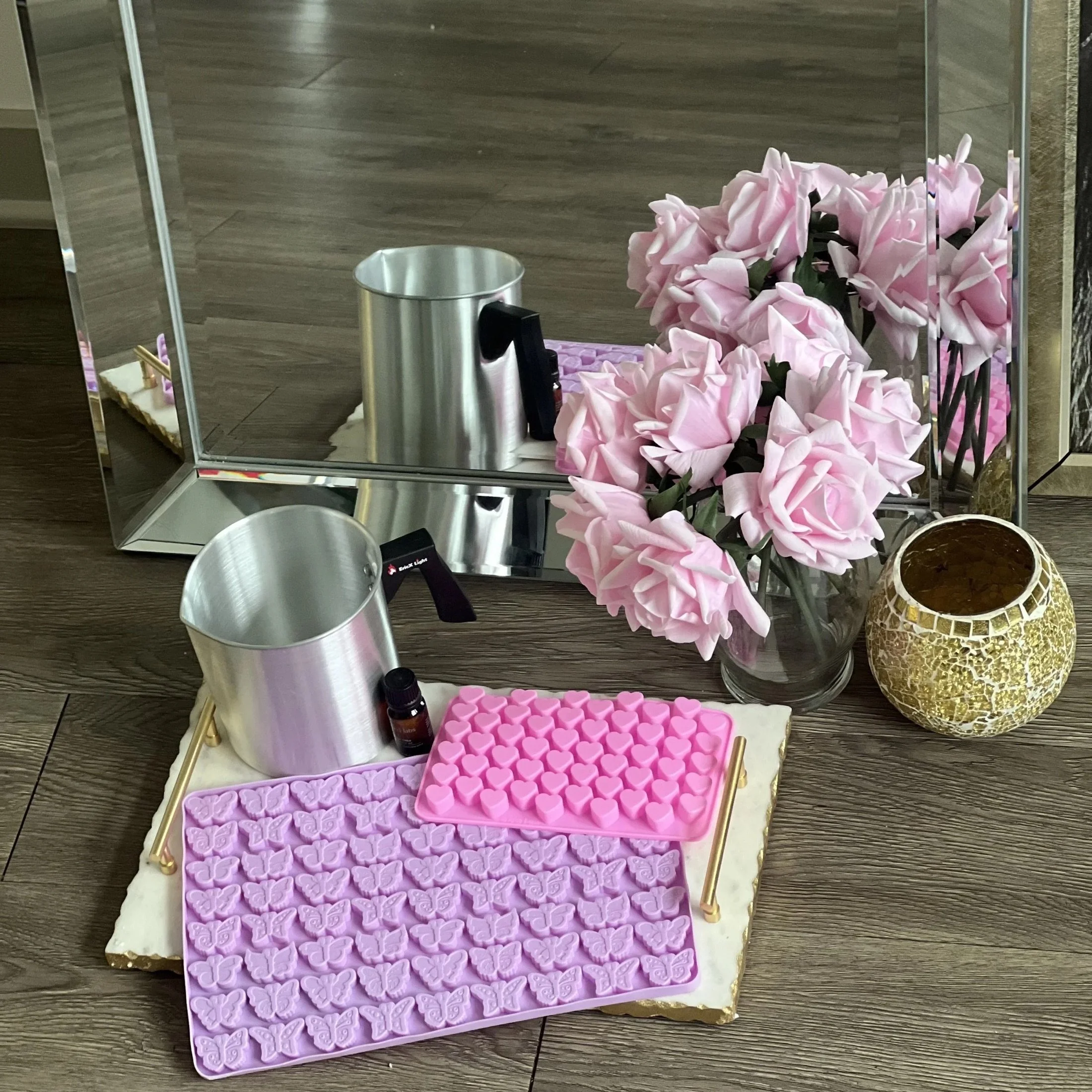 Candle making supplies with pink roses