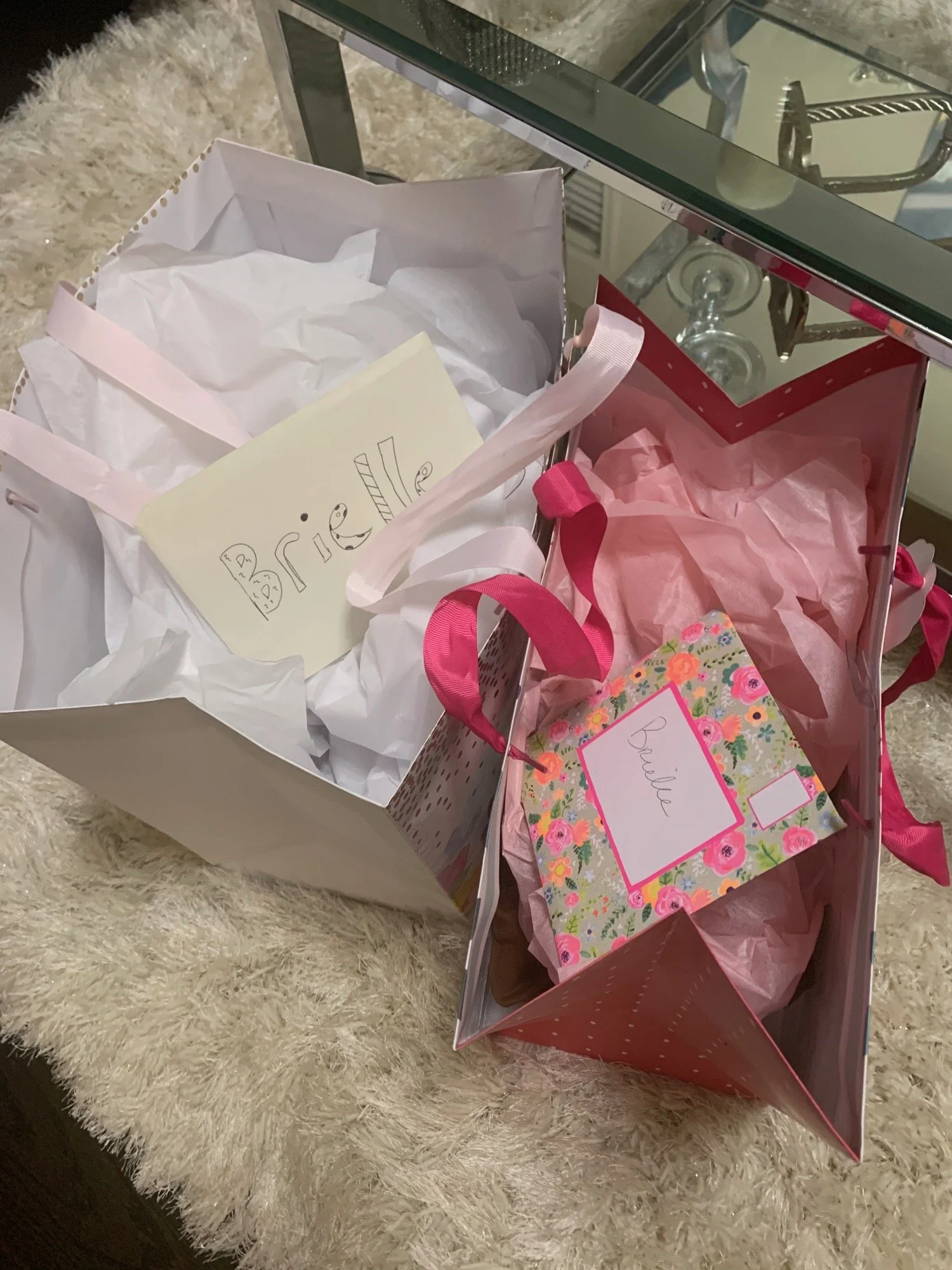 Pink gift bag with a handwritten tag for Brielle