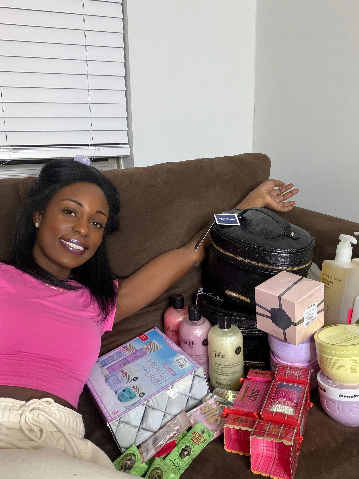 Brielle on the couch with her Marshalls haul