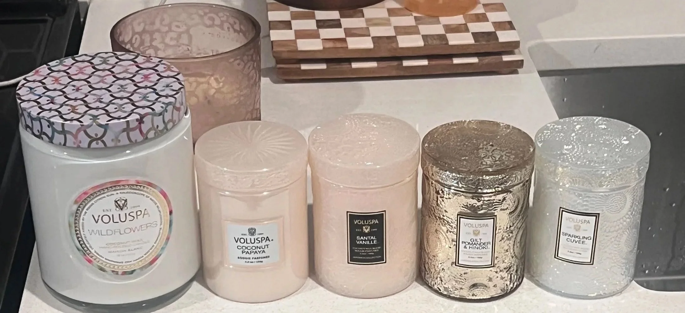 Luxury candle haul lined up on the counter